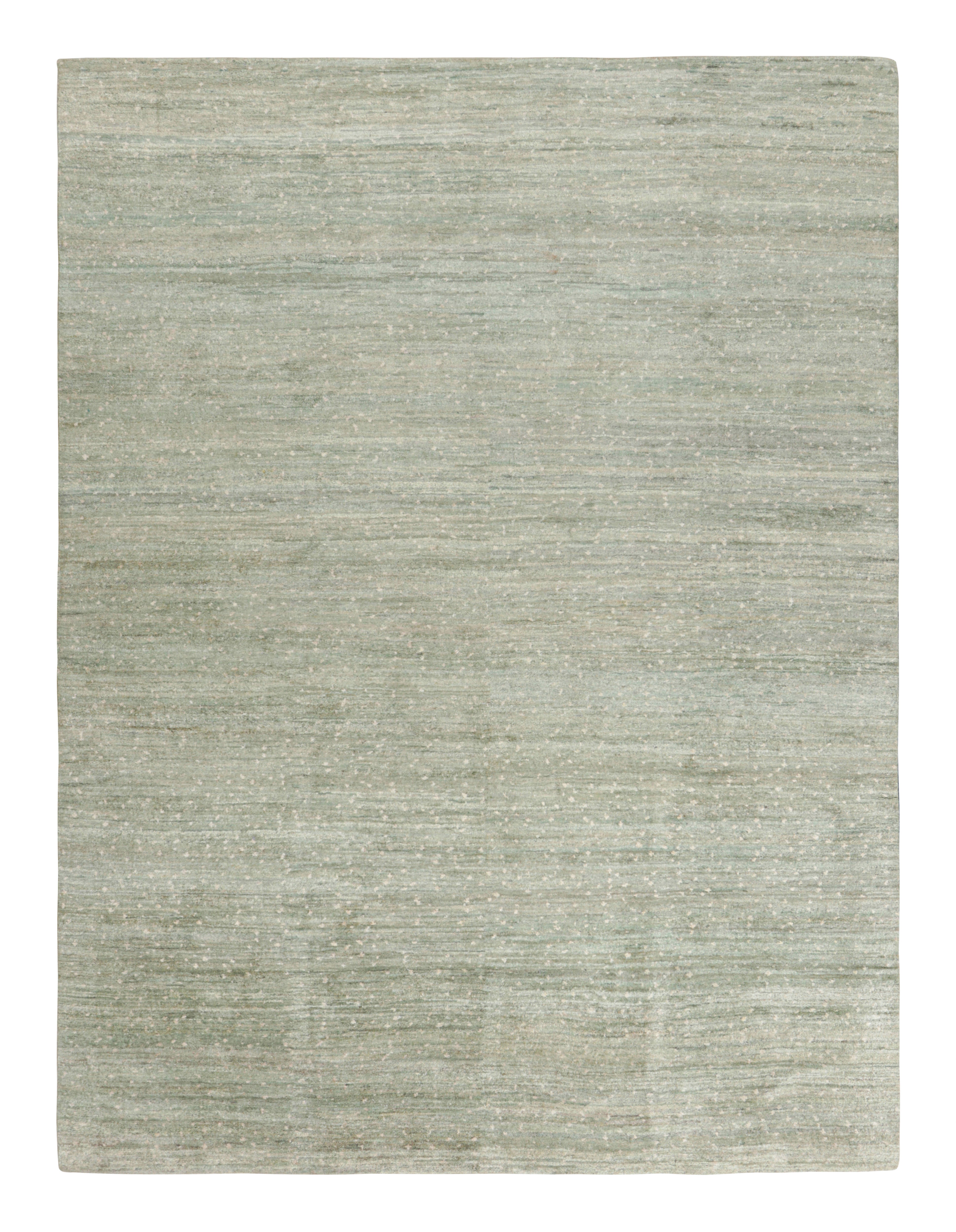 This 9x12 textural rug by Rug & Kilim is an exciting new addition to its Texture of Color collection, made with hand-knotted wool and silk, featuring blue, green and beige stripes and striae among other neutral hues and earth tones.

On the Design:
