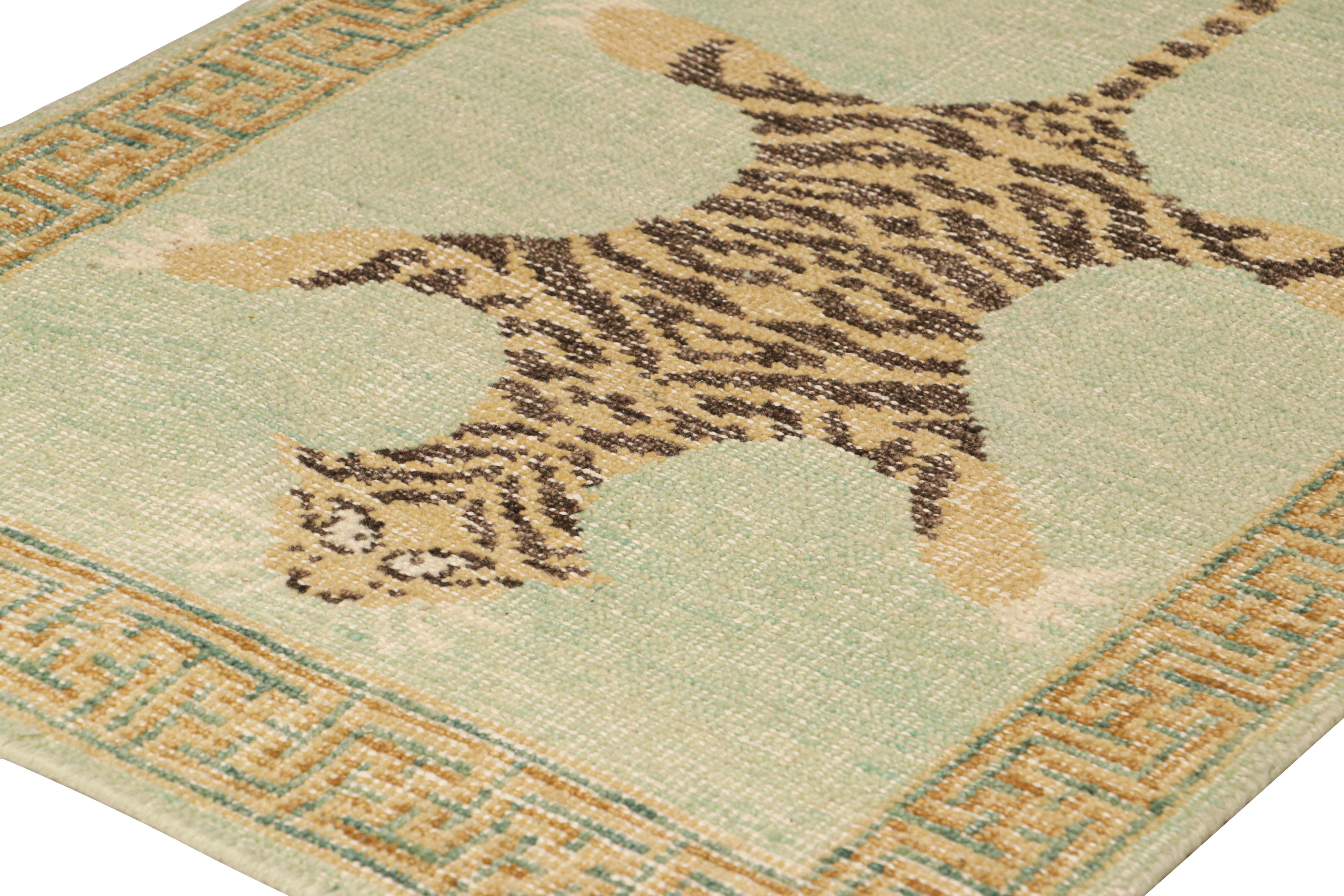 Hand-knotted in wool, this 2x3 modern tiger pictorial rug features a vibrant colorway of green, beige and black tones. 

On the Design: 

Hand-knotted in wool pile, a contemporary rug as inspired by classic antique Indian tiger styles—from our