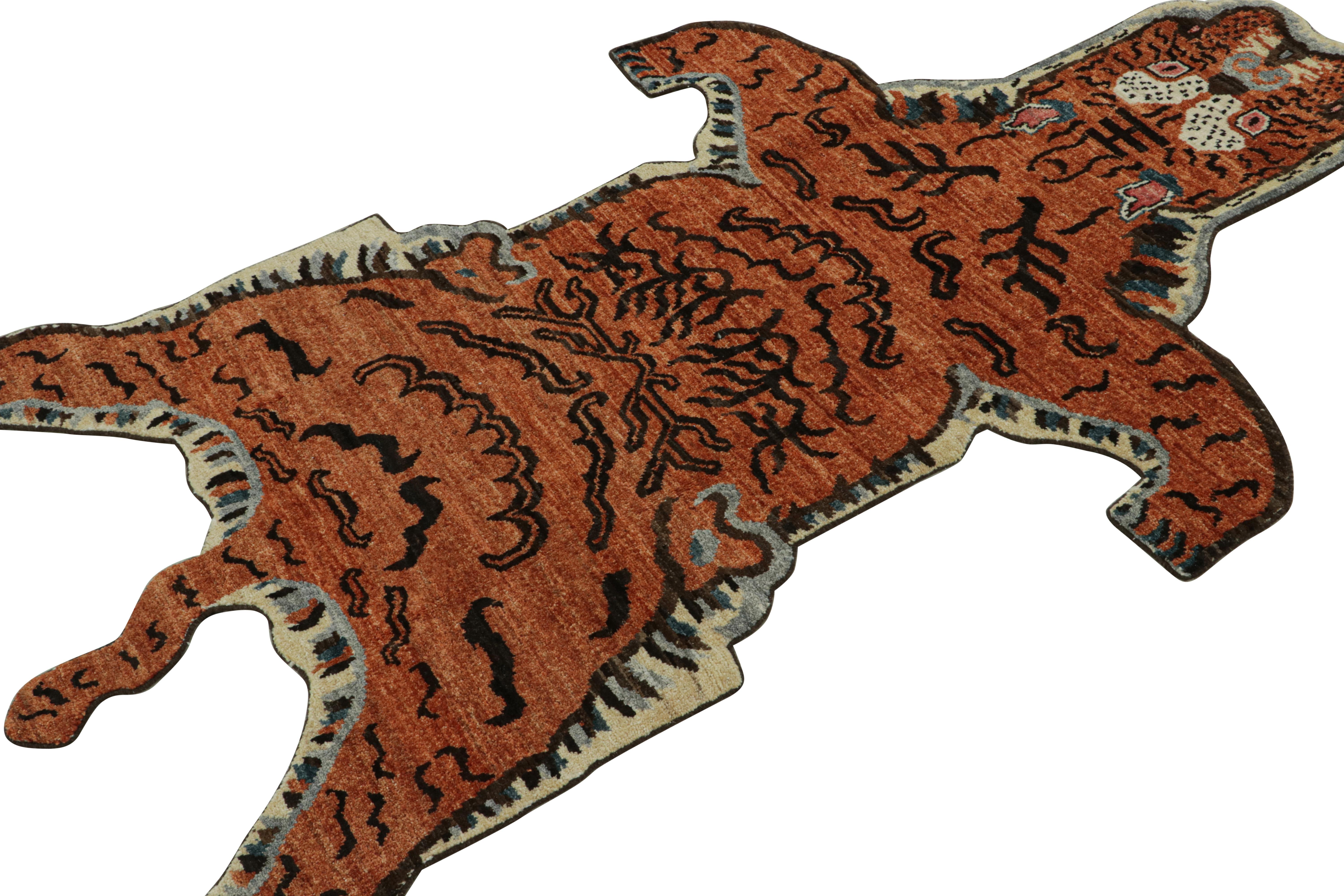This contemporary 4×6 tiger skin irregular shaped rug is a bold new addition to Rug & Kilim’s Modern Classics Tiger Collection. Our collection spans several cultures and recaptures iconic pictorial styles just like this particular rug. 

On the