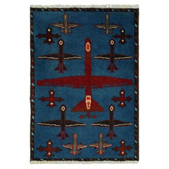 Rug & Kilim - Tappeto tribale moderno in blu con immagini di aeroplani