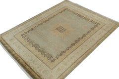 Rug & Kilim’s Mohtasham Style Rug in Blue with Gold Medallion and Beige Florals