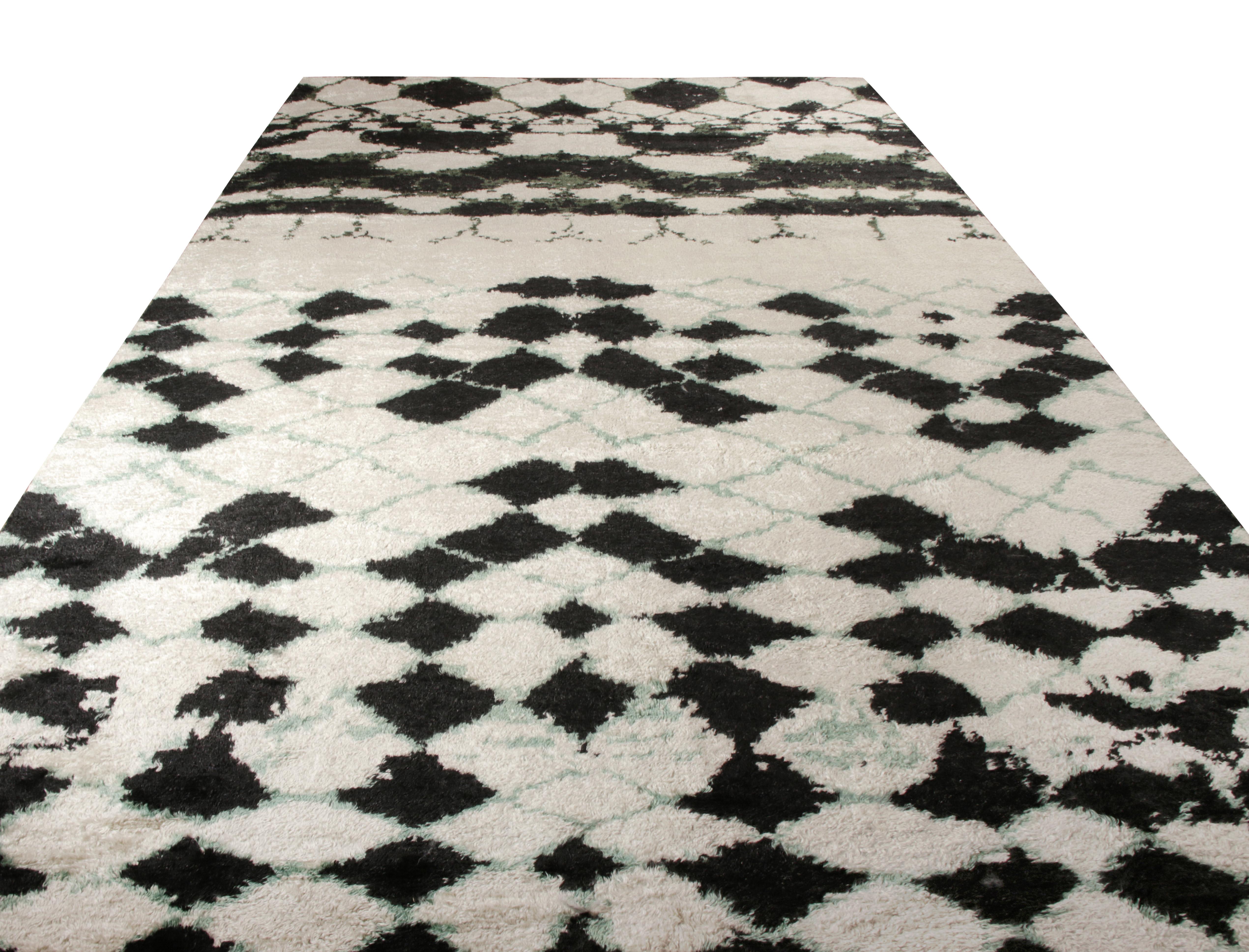 Exemplified in 13x22, a custom Moroccan rug design from Rug & Kilim’s groundbreaking new selections. Hand knotted in wool with a fabulous texture, the rug boasts a bold color selection where a defined black and green geometric pattern lays