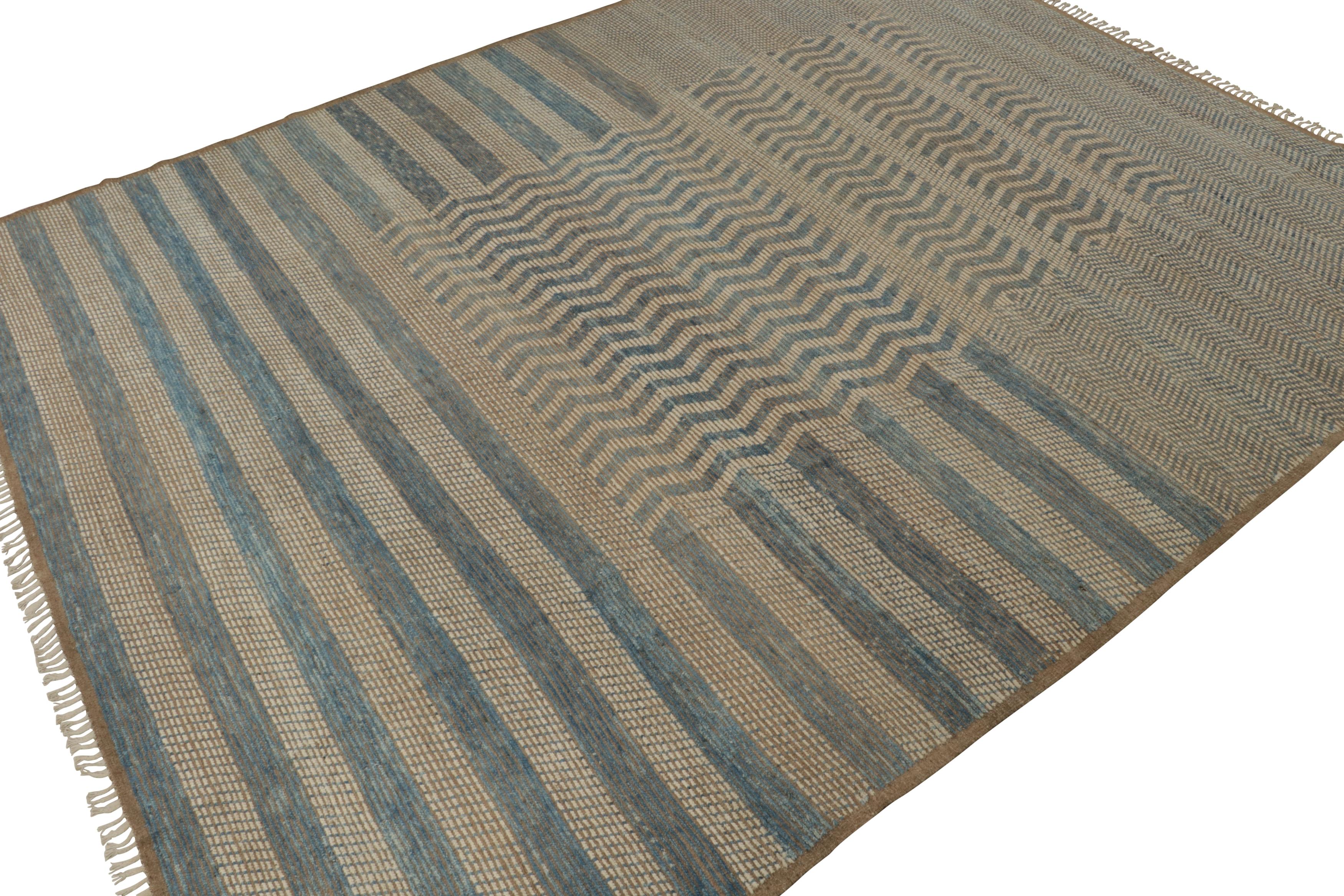 This hand-knotted wool 12x15 rug is a new release from the Moroccan rug collection by Rug & Kilim. Its design represents our modern take on primitivist Berber carpets, and enjoys beige-brown, off-white and blue stripes and chevrons. 

On the Design: