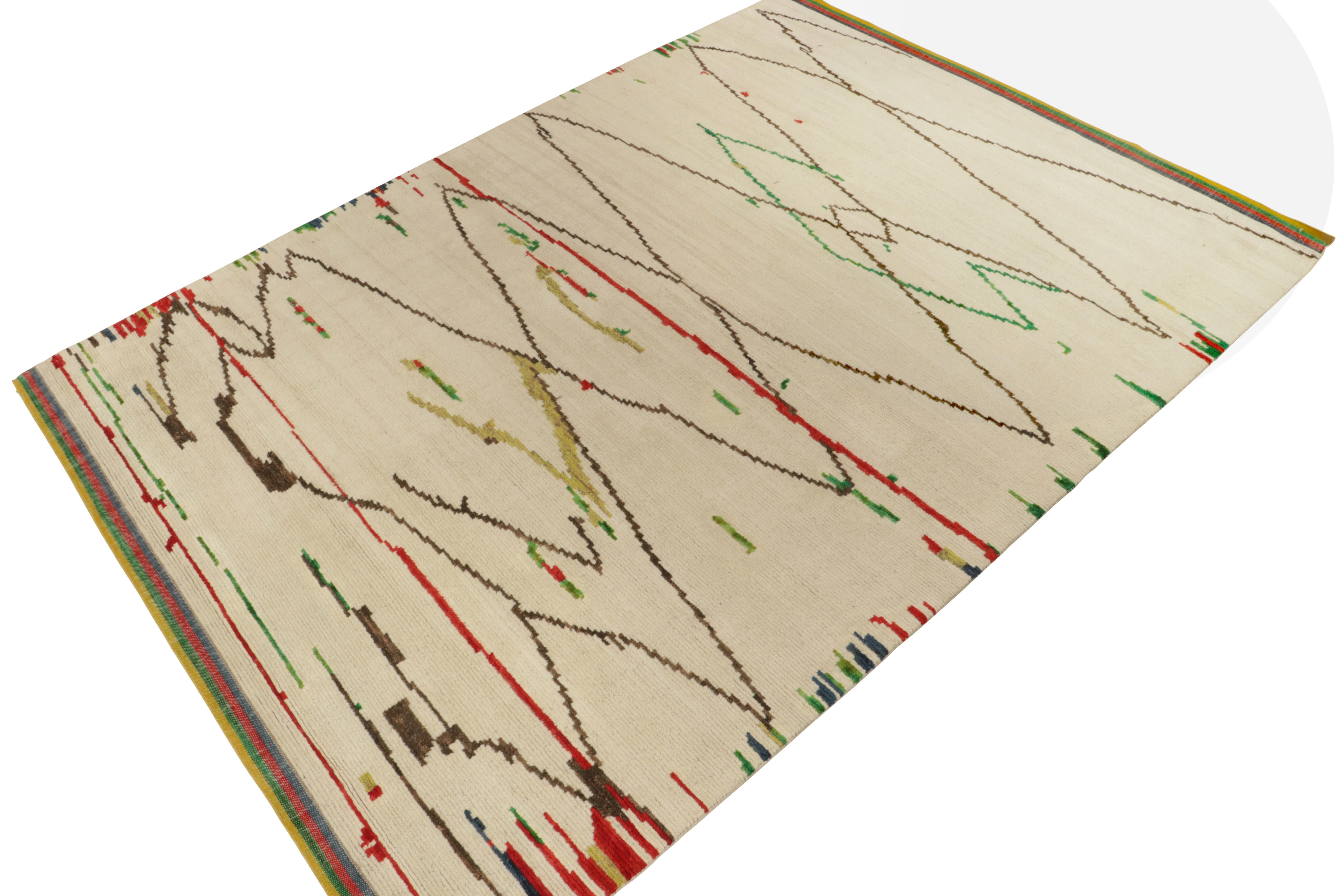 Rug & Kilim’s original ode to Moroccan rug design, carrying a luscious healthy pile in creamy beige comfortably mothering a defined geometric pattern in muted brown tones. The tribal aesthetics of this style enjoy a joyful play of crimson red,