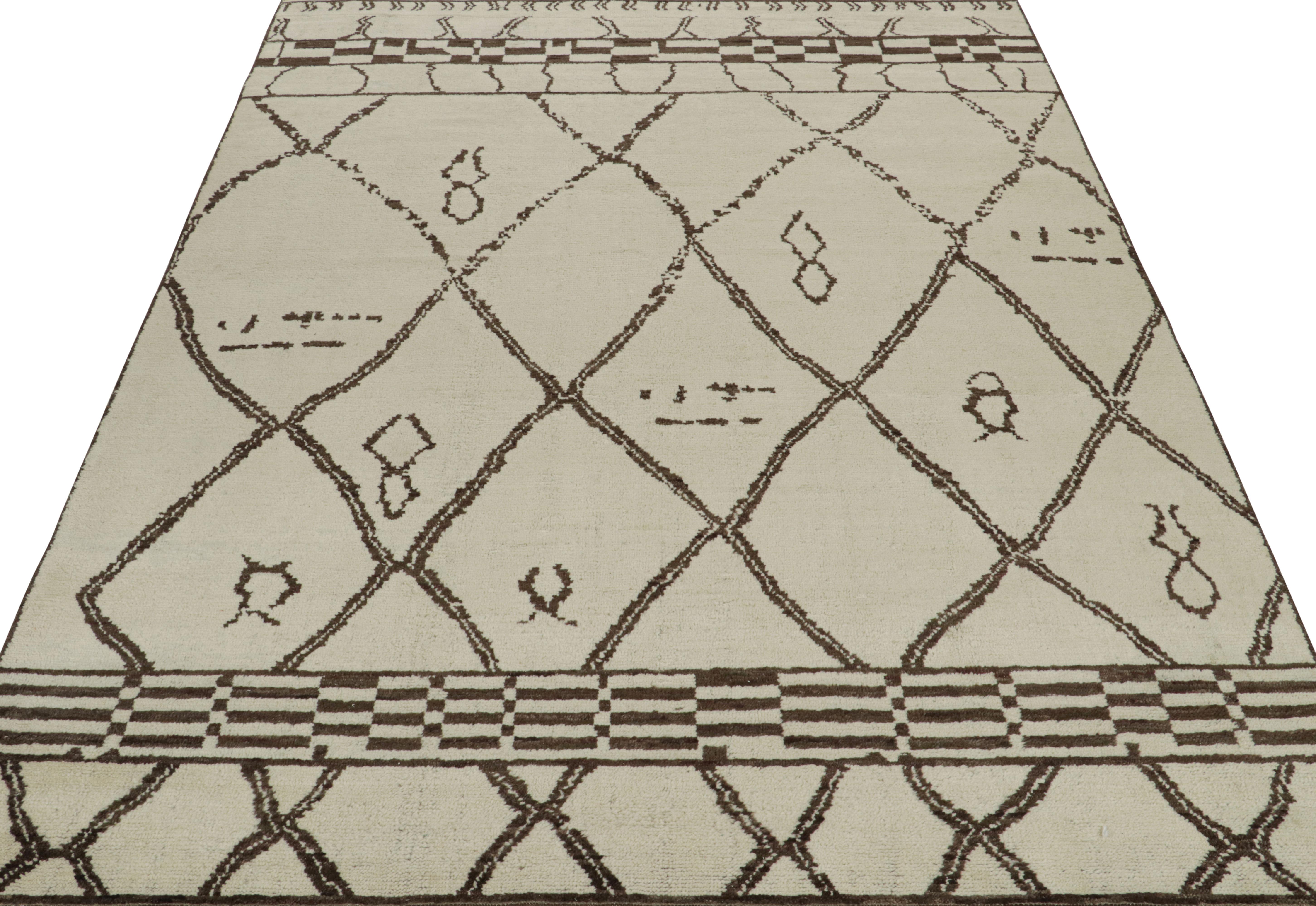 This contemporary 9x12 rug is a grand entry in Rug & Kilim's new Moroccan Collection—a bold take on the iconic style. Hand-knotted in wool and cotton.
Further on the Design:
The piece draws on geometric patterns and archaic motifs in rich brown