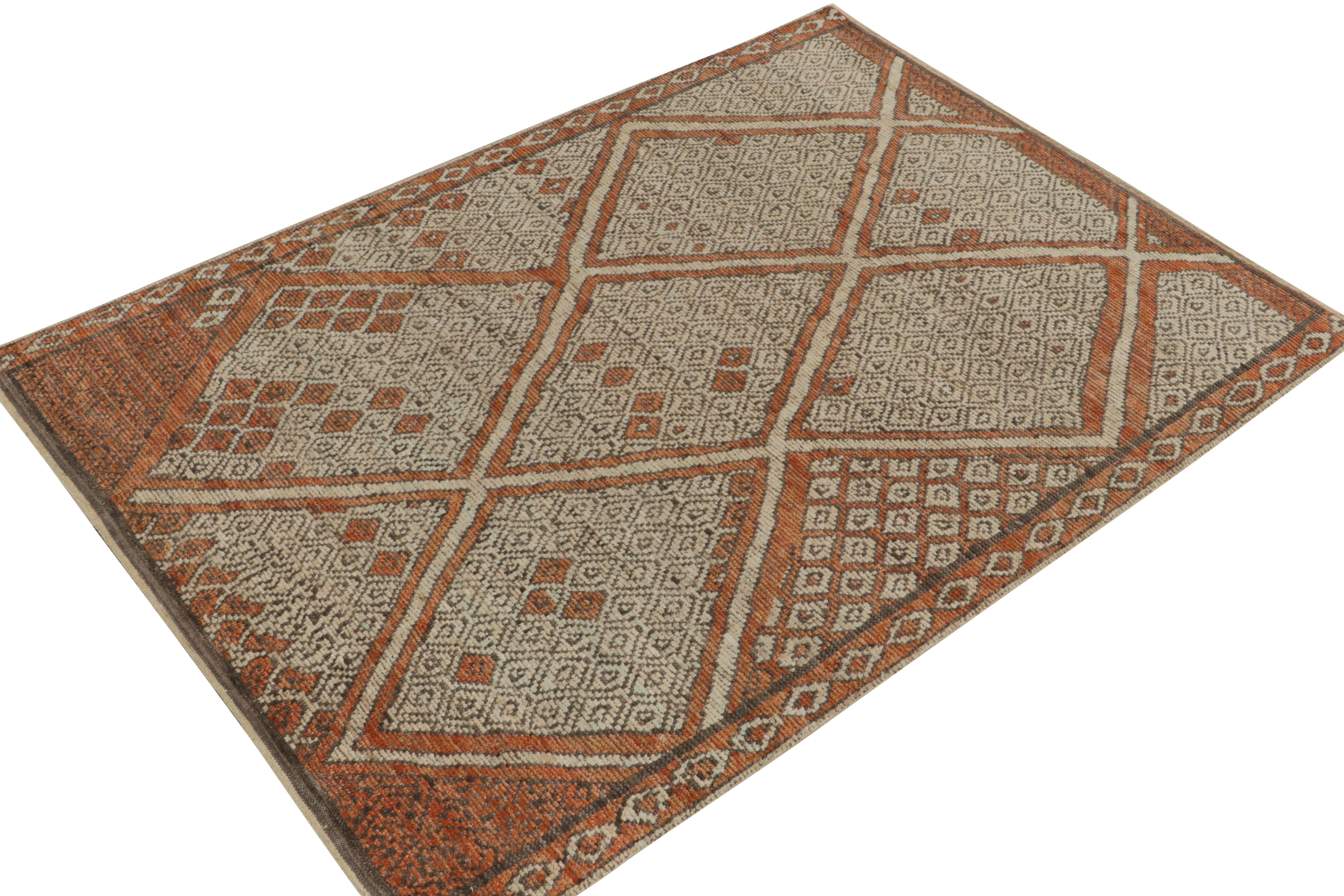 Hand-knotted in fine wool, a 7x9 Moroccan style piece from Rug & Kilim exemplifying their bold new take on this style. 

On the Design: The carpet enjoys scintillating pagination with archaic diamond patterns in rust orange, white & beige-brown.