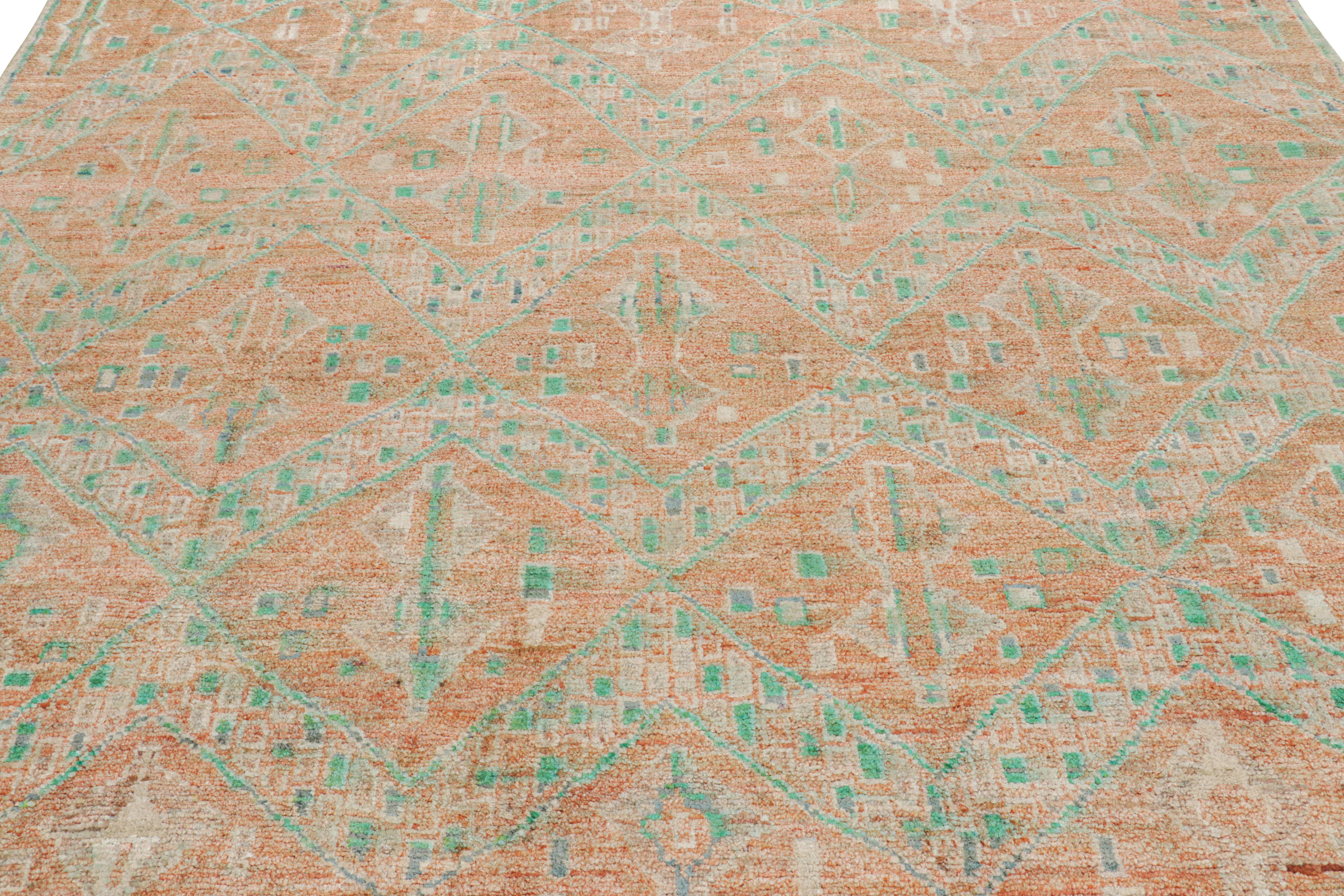 Hand-knotted in wool and silk, this 8x10 contemporary rug from Rug & Kilim features geometric patterns with a modern appearance—drawing on the primitivist Berber tribal designs. 

On the Design: 

A rich, lush pile in orange, green and blue tones