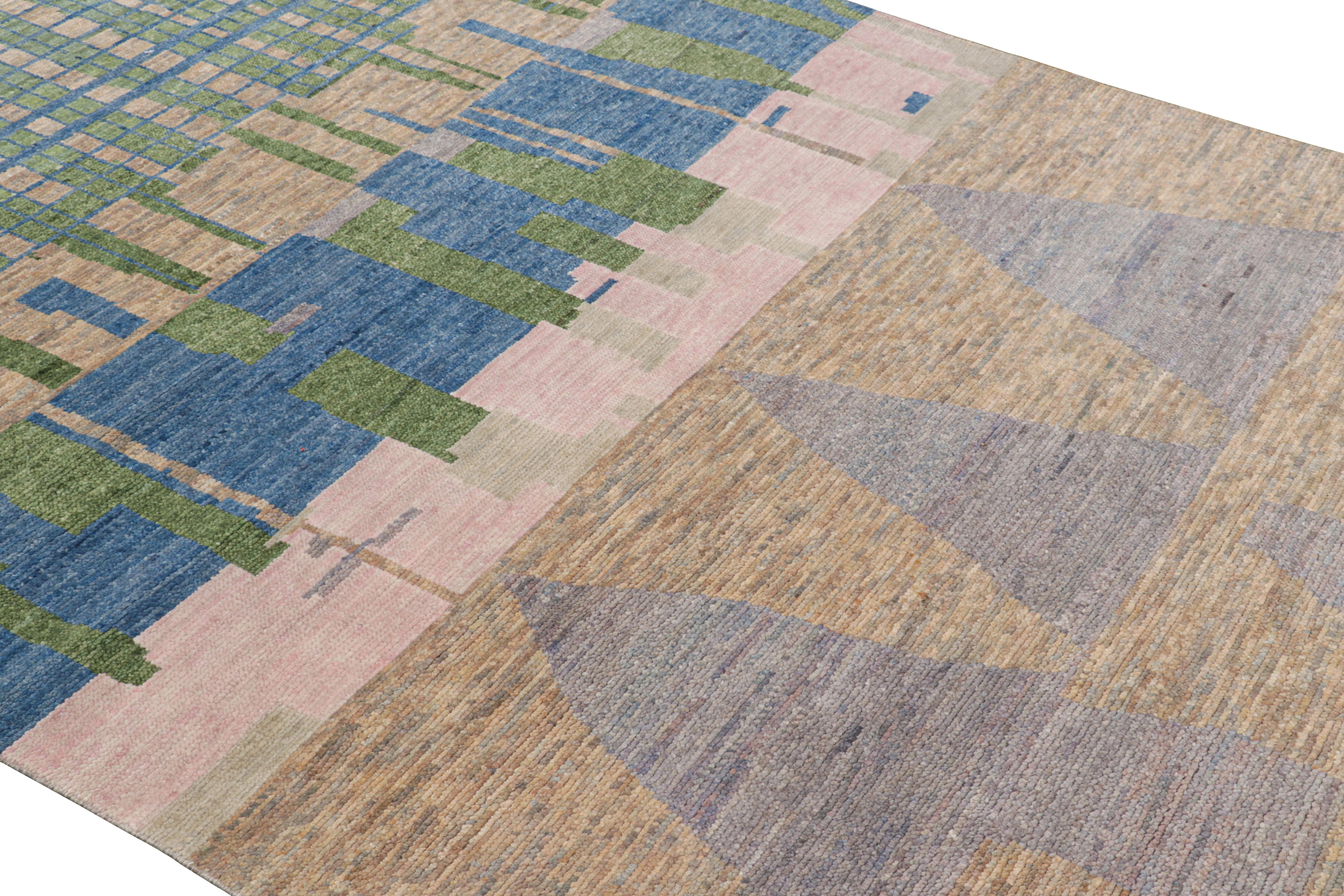 Hand-knotted in wool and silk, this 6x9 contemporary rug from Rug & Kilim features geometric patterns with a modern abstract appearance—drawing on the primitivist Berber tribal designs. 

On the Design: 

A rich, lush pile in polychromatic tones