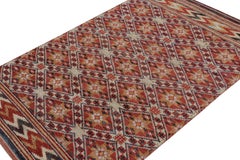 Rug & Kilim’s Moroccan Style Rug in Red with Gold Geometric Patterns