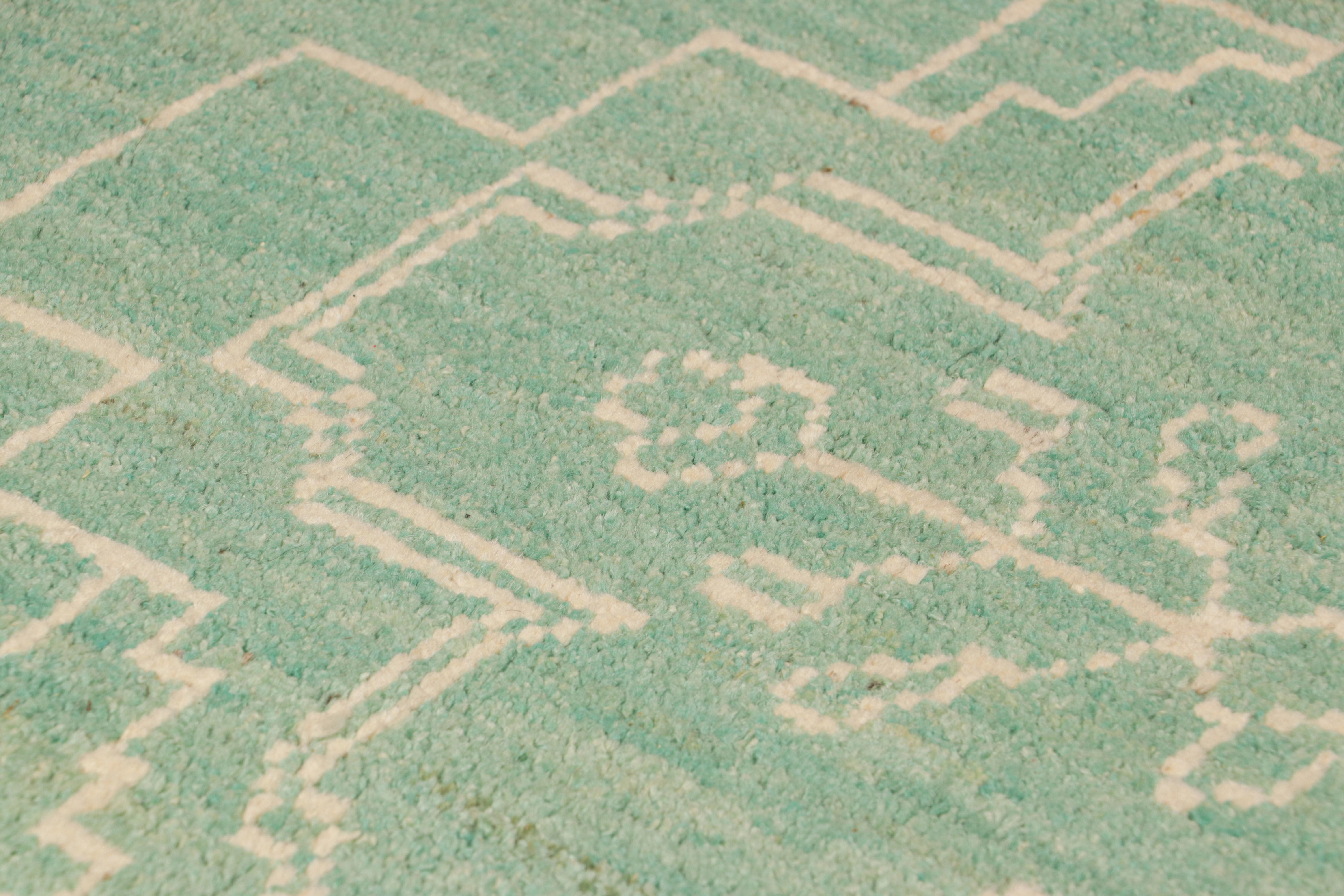 Hand-knotted in wool, this 2x3 contemporary rug from Rug & Kilim features geometric patterns with archaic architectural lines and floral motifs—drawing on the primitivist Berber tribal Boucherouite designs. 

On the Design: 

A rich, lush pile in