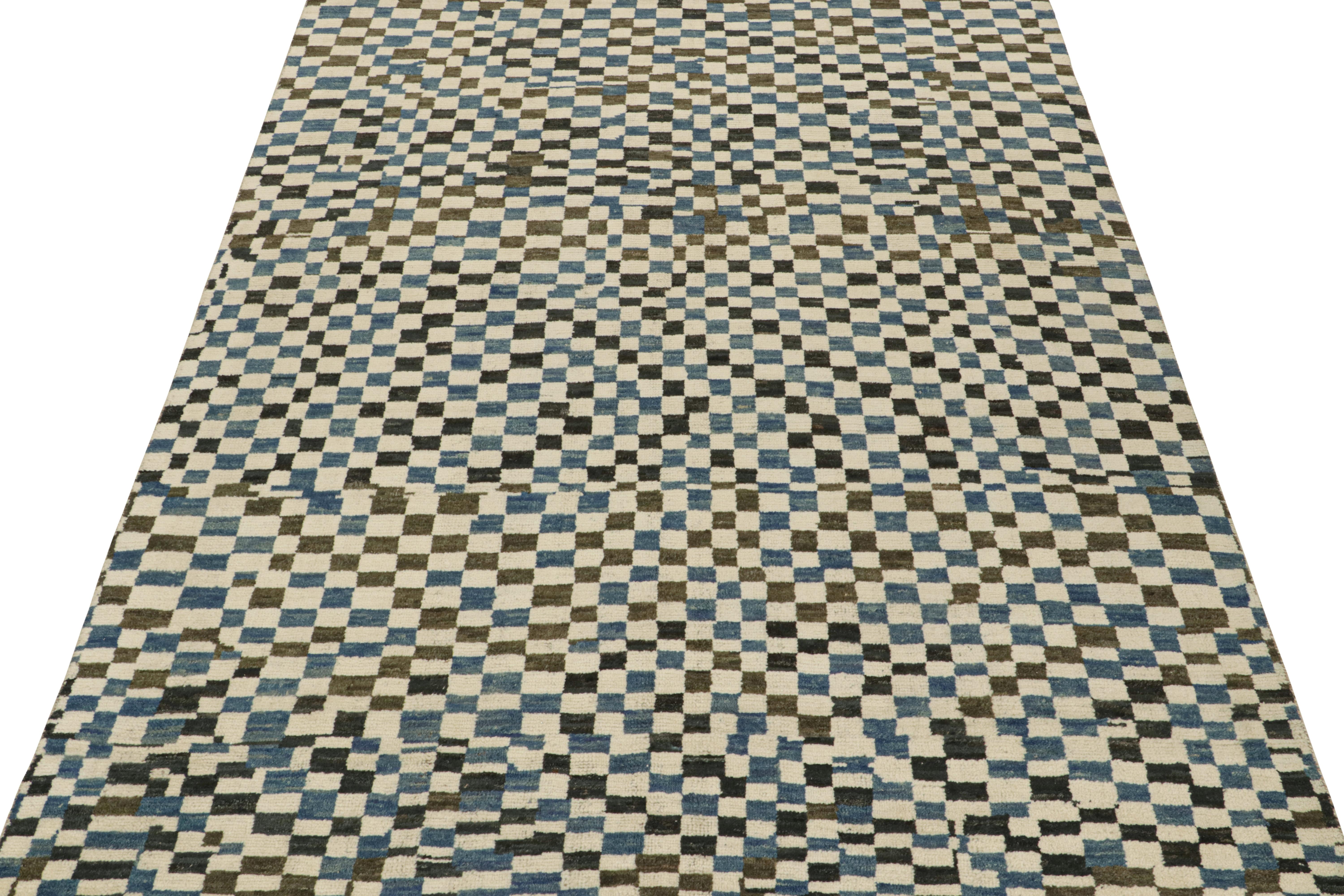 This 9x12 rug is a new addition to Rug & Kilim’s Moroccan rug collection. Hand-knotted in wool, its design recaptures the classic tribal sensibility in a new modern quality.

This particular design enjoys checkered patterns in tones of blue, dark
