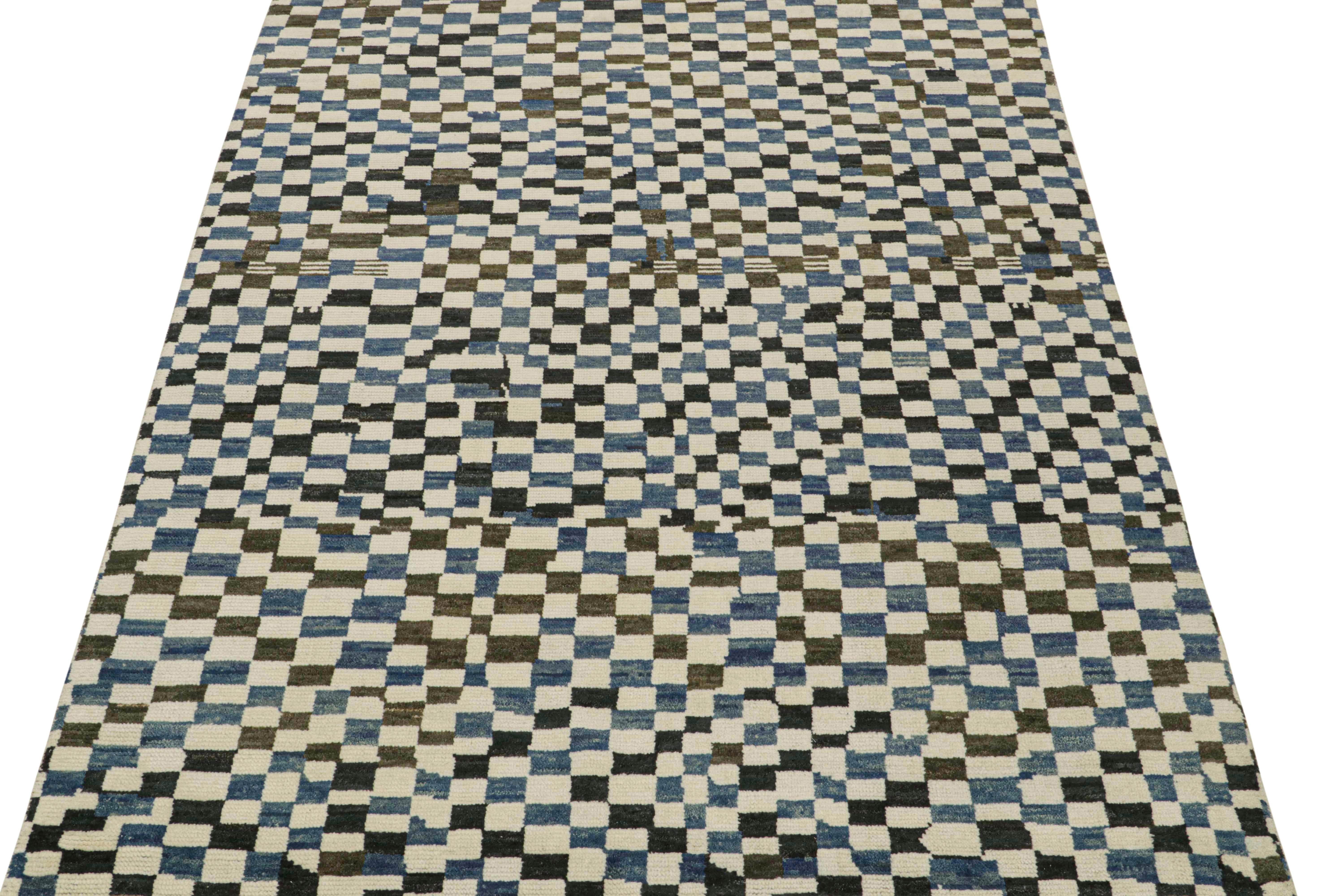 This 8x11 rug is a new addition to Rug & Kilim’s Moroccan rug collection. Hand-knotted in wool, its design recaptures the classic tribal sensibility in a new modern quality.

This particular design enjoys checkered patterns in tones of blue, dark