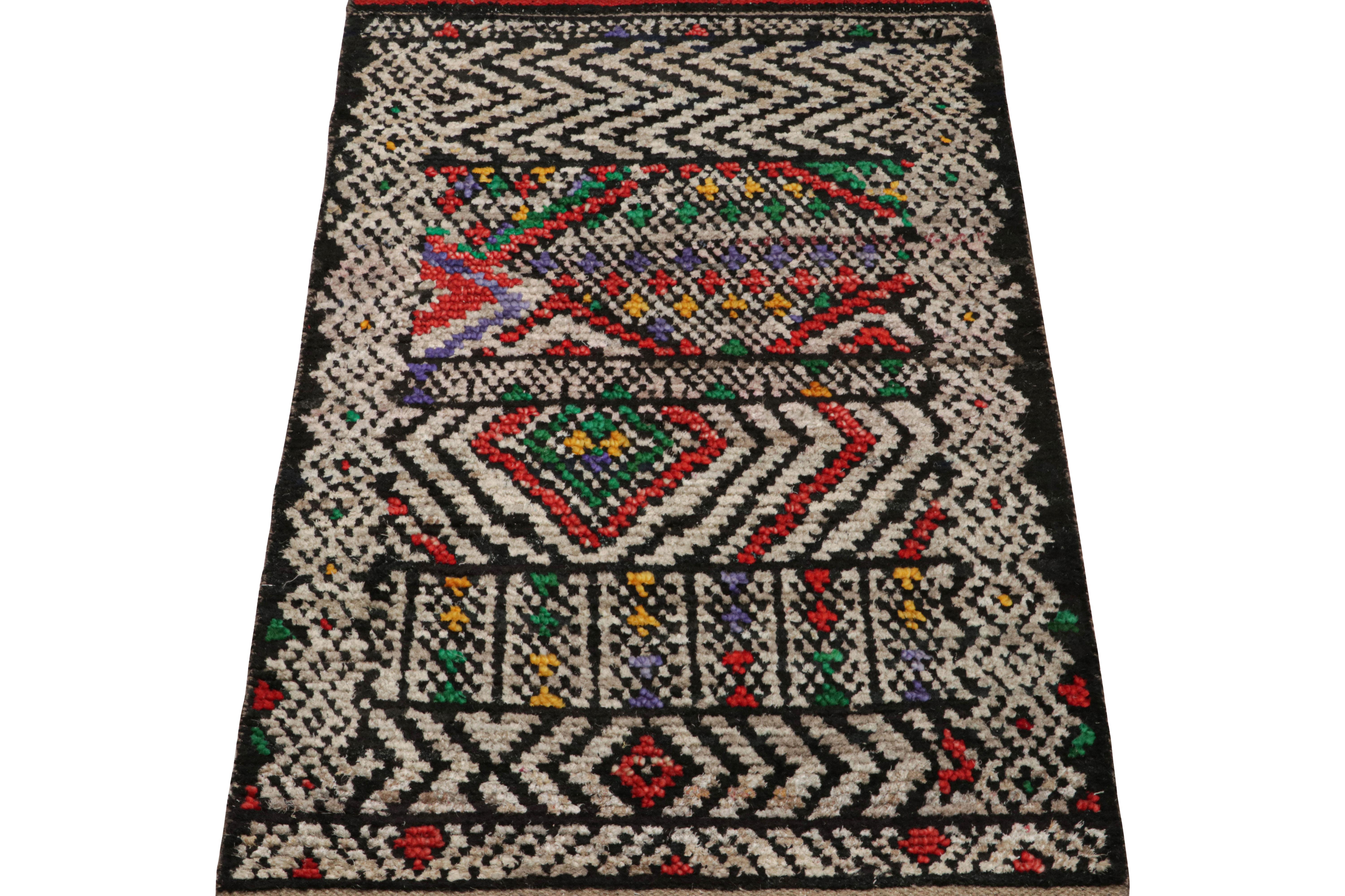 Hand-knotted in wool and silk, this 2x3 Moroccan rug features geometric patterns inspired by primitivist Berber weaving traditions and same ribbed texture drawing on Boucherouite sensibilities. 

On the Design: 

Connoisseurs may admire the subtle