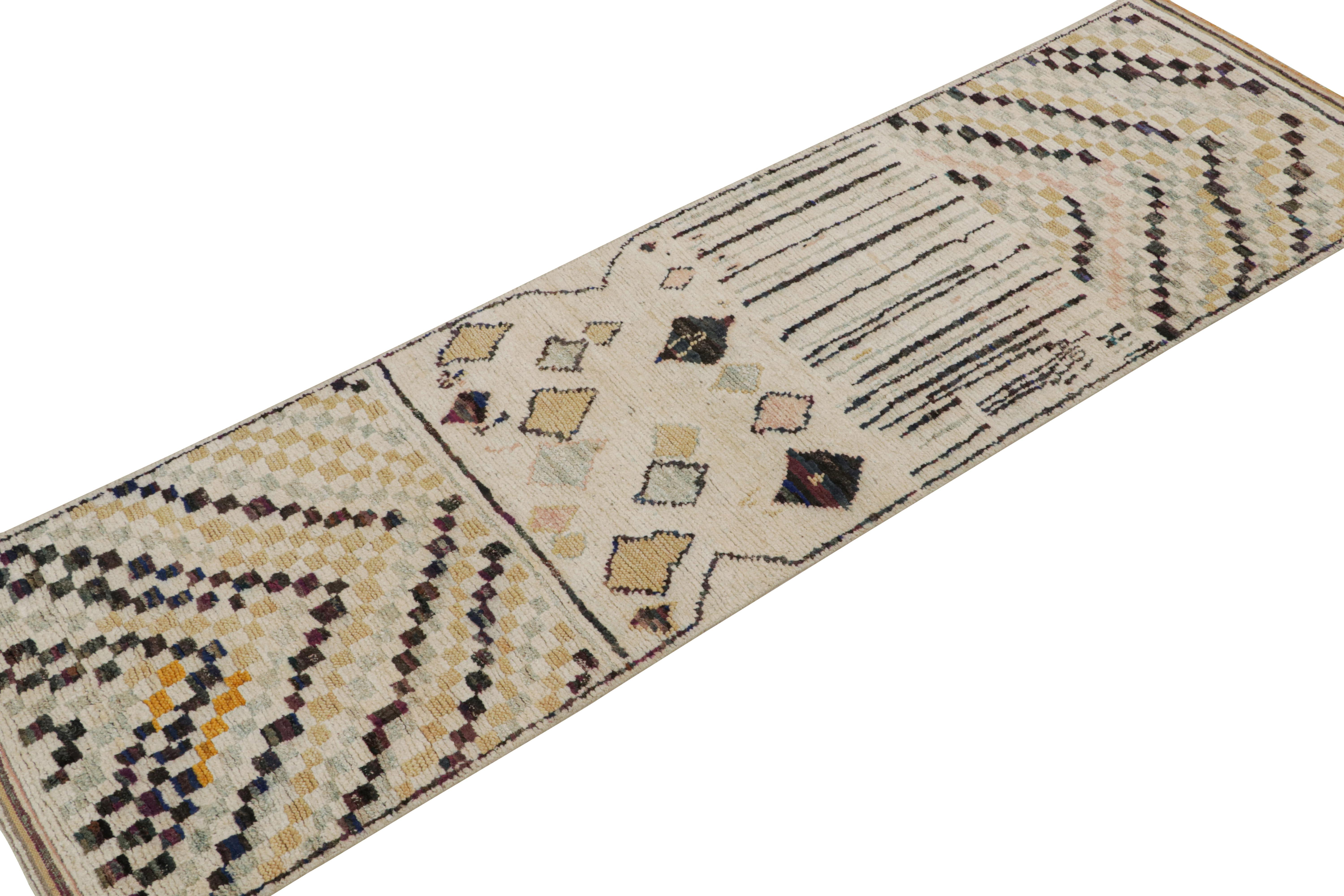 Hand-knotted in wool, cotton and silk, this 3x10 runner rug is from the Moroccan rug collection by Rug & Kilim. 

On the Design:

This designs represent a modern take on the Berber primitivist style, with colorful geometric patterns on a beige