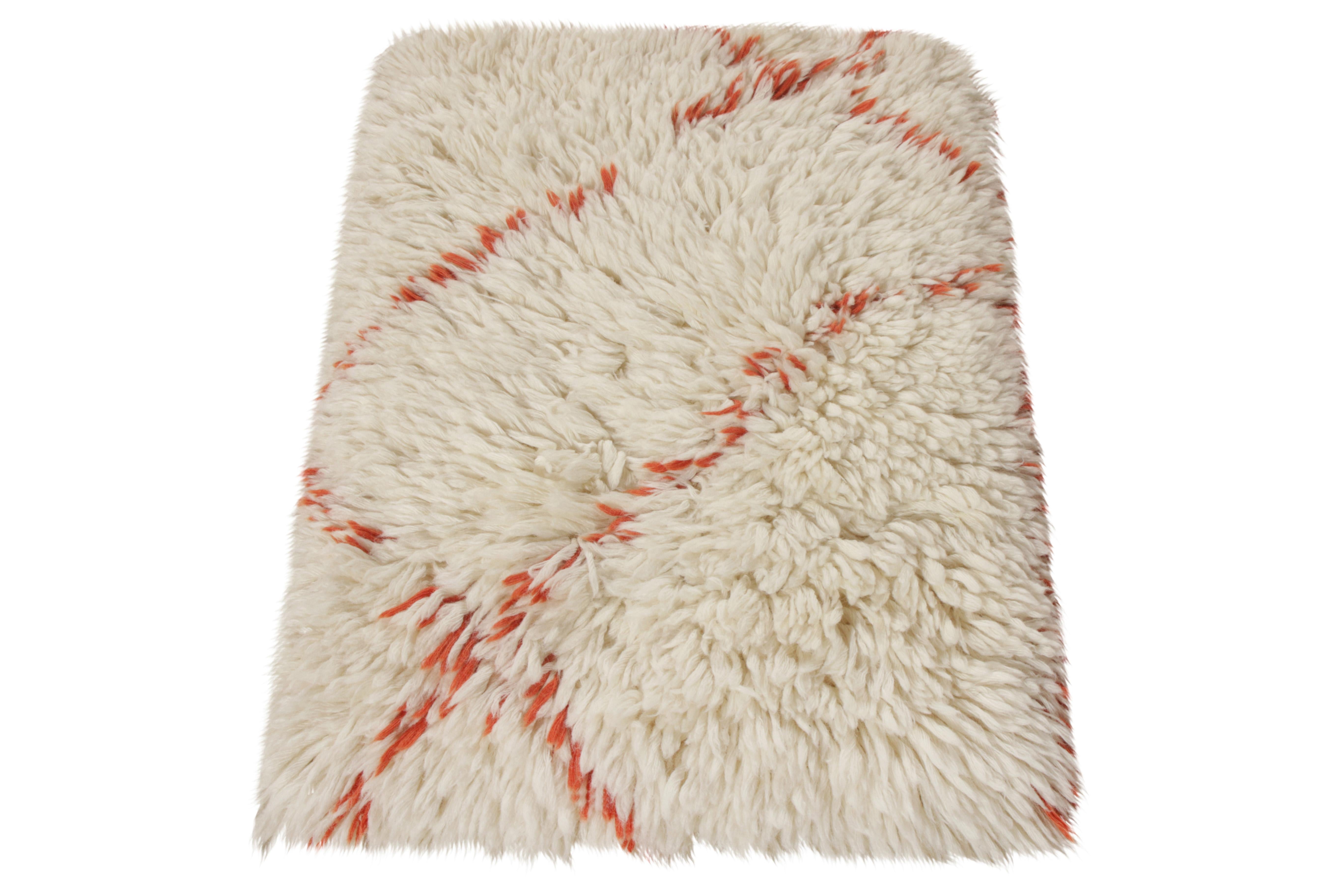 Hand knotted in lush, quality wool, a 2x3 Moroccan style accent rug from Rug & Kilim. Creating a unique expression of both traditional and modern thoughts, the rug carries the essence of tribal vibe with its unique pattern superimposing a frame of