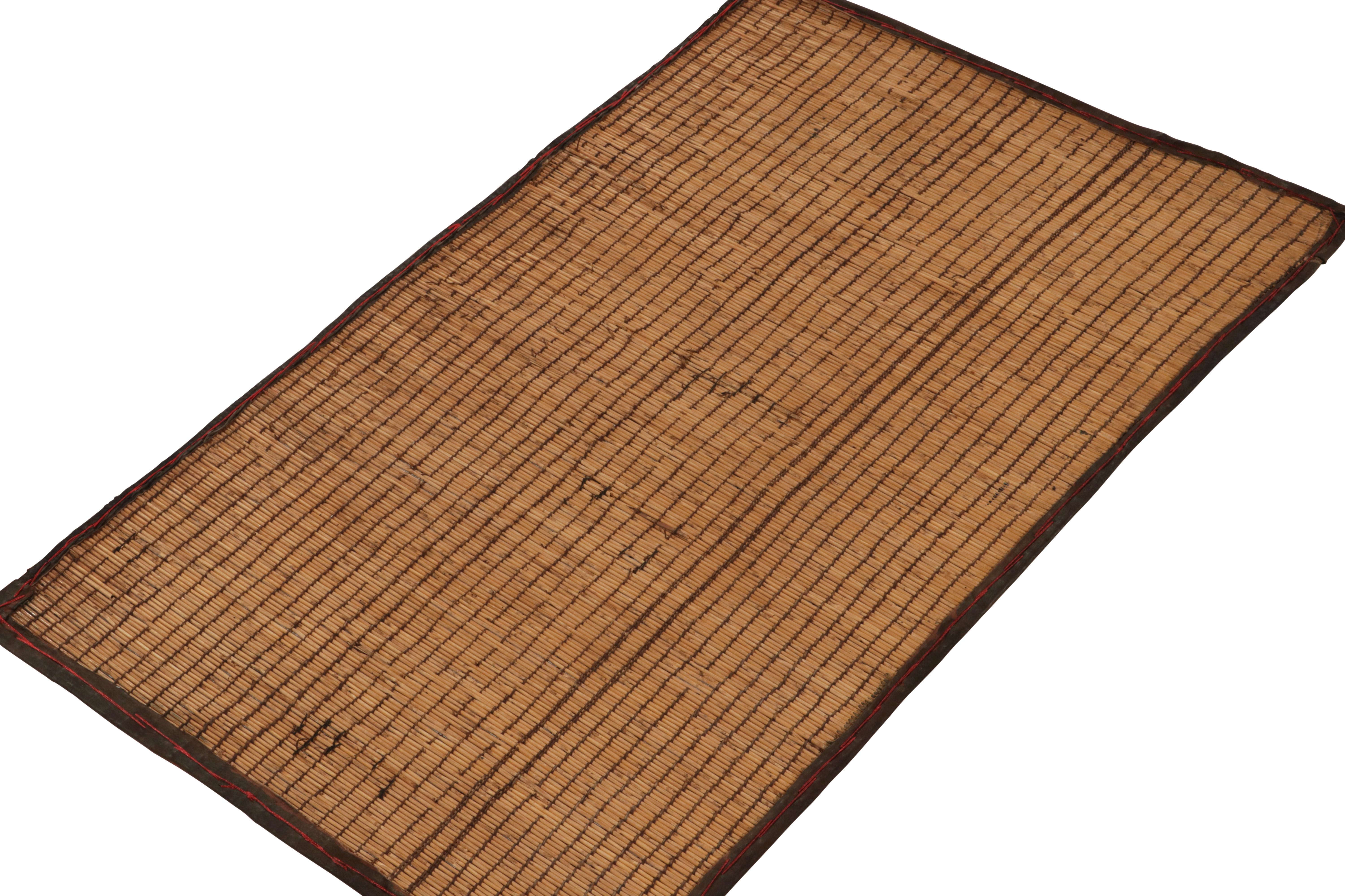 Handwoven with reeds, Rug & Kilim’s unique contemporary take on Tuareg mats, inspired by the titular vintage Moroccan weaving tradition. 

The sophisticated rendition of classic style witnesses a gorgeous accent play on a forgiving beige-brown scale