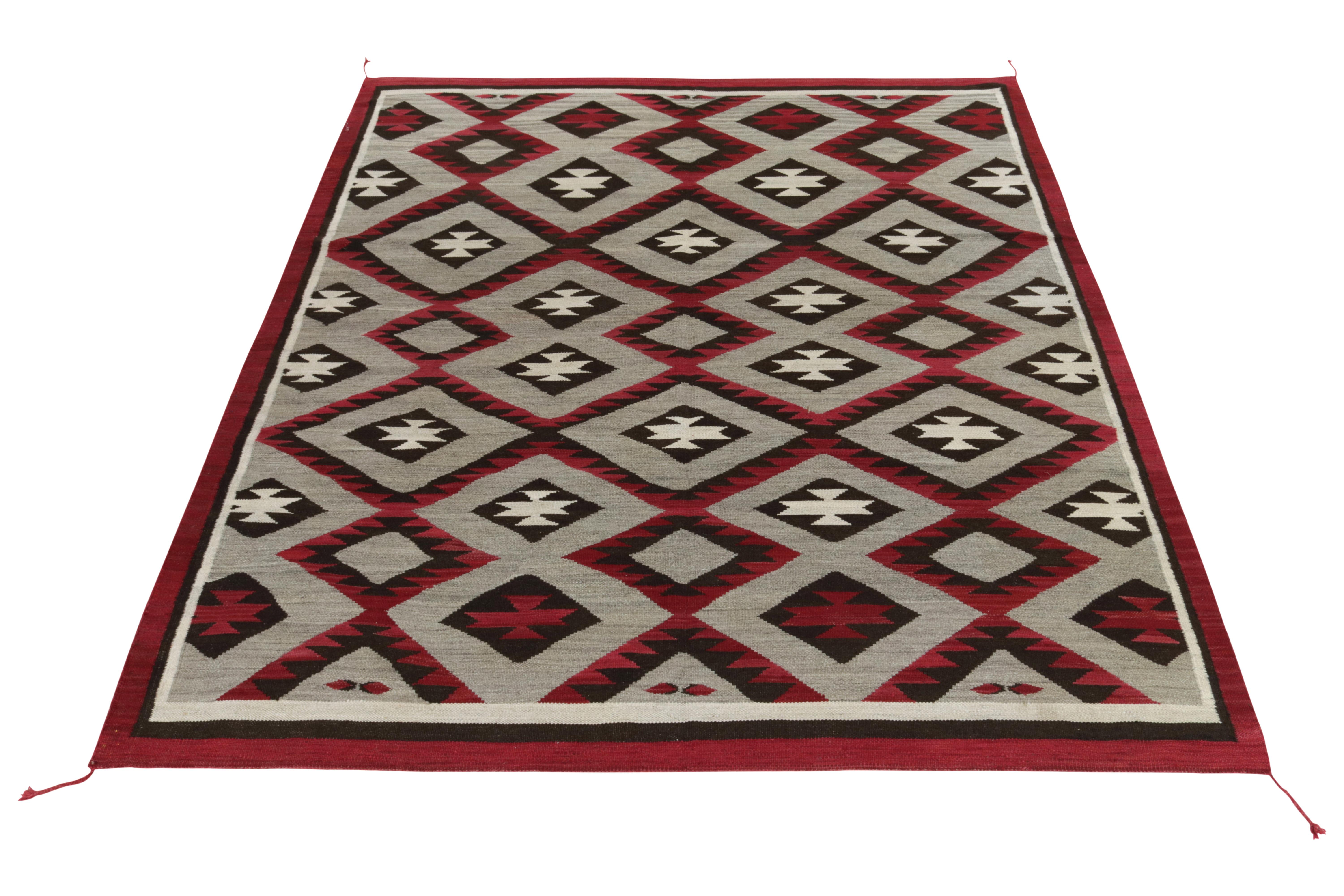 Handwoven in fine quality wool, an 8x10 ode to Navajo Kilim rug blending tribal sensibilities with impeccable modern reimagining. Inspired by the 1920s Navajo flatweaves, this flat weave showcases a sharp tribal geometric pattern in an idyllic