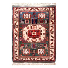 Rug & Kilim's New Kazak Transitional Red and Green Wool Rug with Horn Motifs (en anglais seulement)