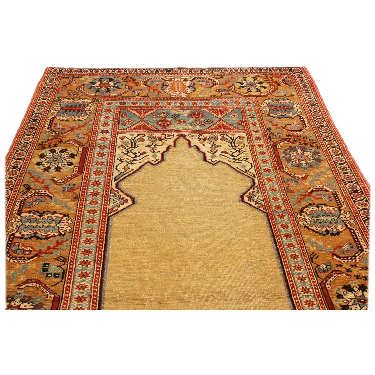 Originating from Turkey, this new transitional wool rug depicts an ottoman design in rich and varied colorways resembling select antique pieces. Hand knotted in high quality wool in low pile, the open sand beige Mihrab field design (representing the