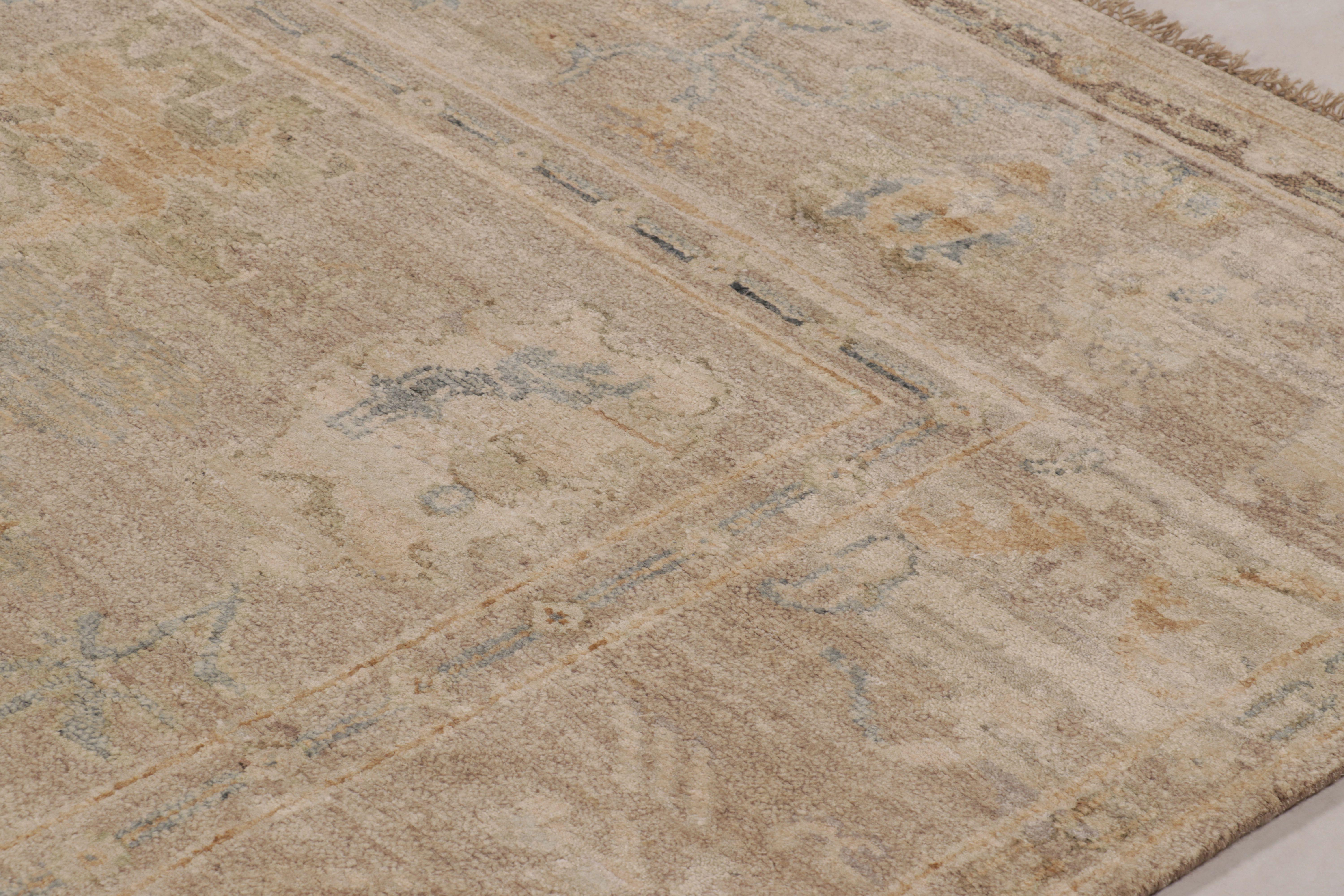 This magnificent 9x12 rug from Rug & Kilim’s Modern Collection is a masterful study in ethereal beauty and soft neutrality, hand-knotted in a luxurious blend of wool and silk. The design is directly inspired by classic Oushak carpets, borrowing