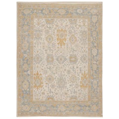 Rug & Kilim’s Oushak Rug in Beige, Gold and Blue Floral Patterns