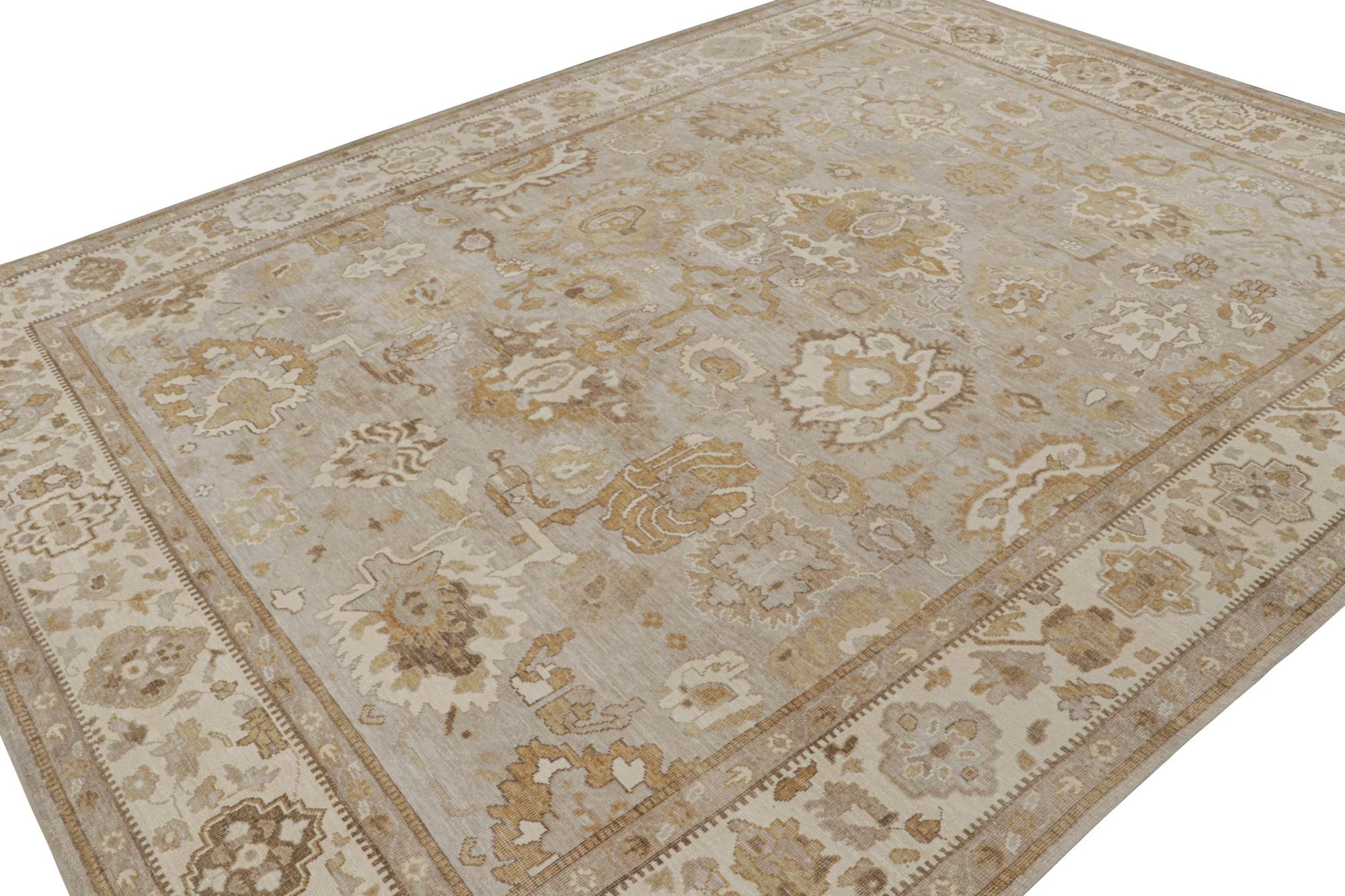 This 12x15 rug from the Modern Classics Collection by Rug & Kilim is from a new line inspired by antique Oushak rugs. Hand-knotted in wool & sari silk, its design enjoys beige-brown & gold floral patterns.  

On the Design: 

The rug is made with a
