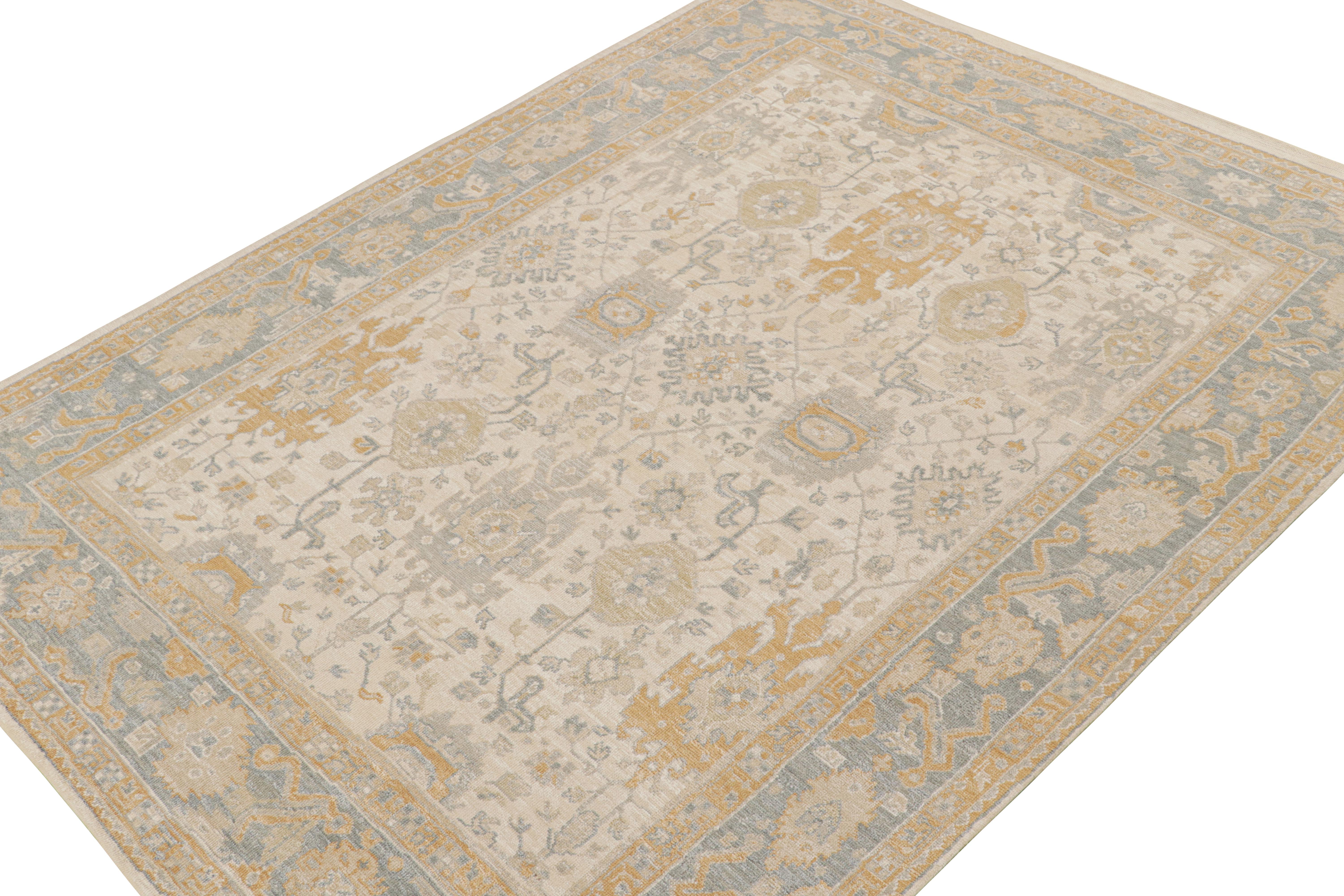 This 9x12 rug from the Modern Classics Collection by Rug & Kilim is from a new line inspired by antique Oushak rugs. Hand-knotted in silk, its design enjoys floral patterns with beige-brown, light gold and ice blue tones.

On the Design: 

The rug