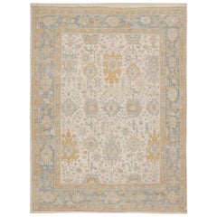 Tapis Oushak de Rug & Kilim à motifs floraux beige, or et bleu