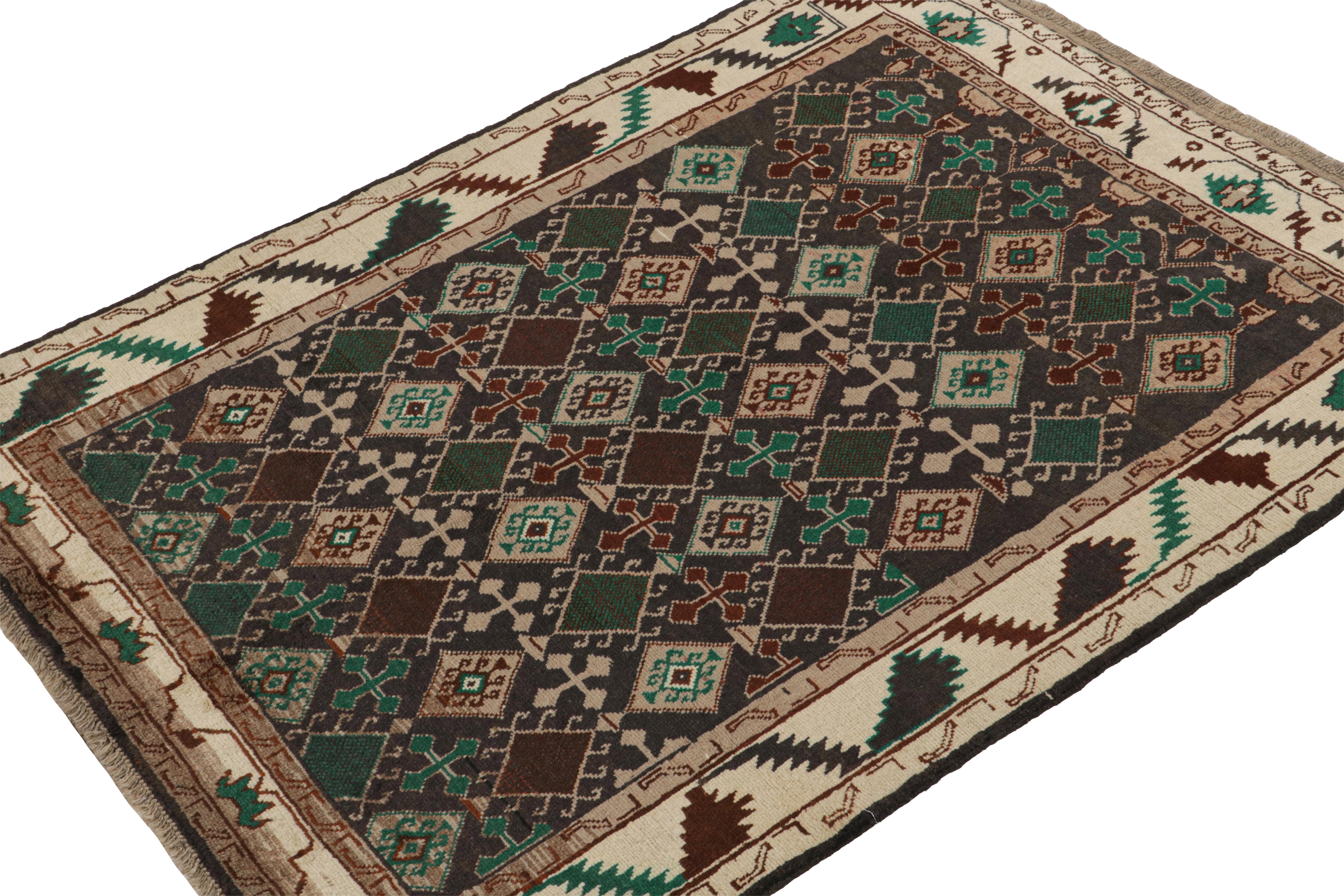 Inspired by Oushak rugs, this 5x6 rug is the latest to join Rug & Kilim’s Modern Classics collection. 

Hand-knotted in wool, its design plays rich brown with teal and forest green in diamonds and other geometric patterns in a tribal style. 