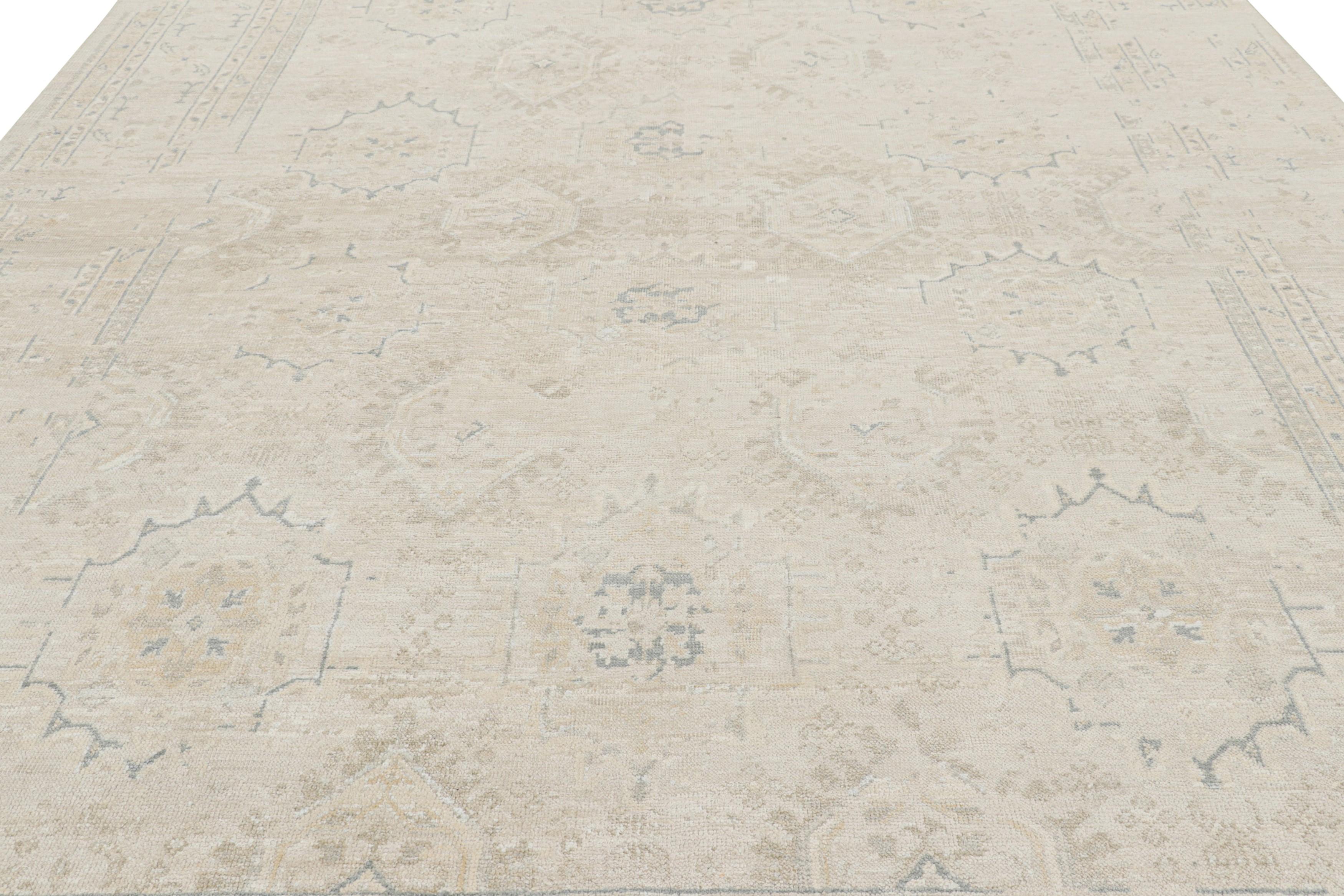 Made with hand-knotted wool and silk, this 9x14 contemporary rug is inspired by vintage and antique Oushak rug designs.

On the Design: 

Connoisseurs may admire the field with cream, ivory white, blue and beige tones along with gray accents