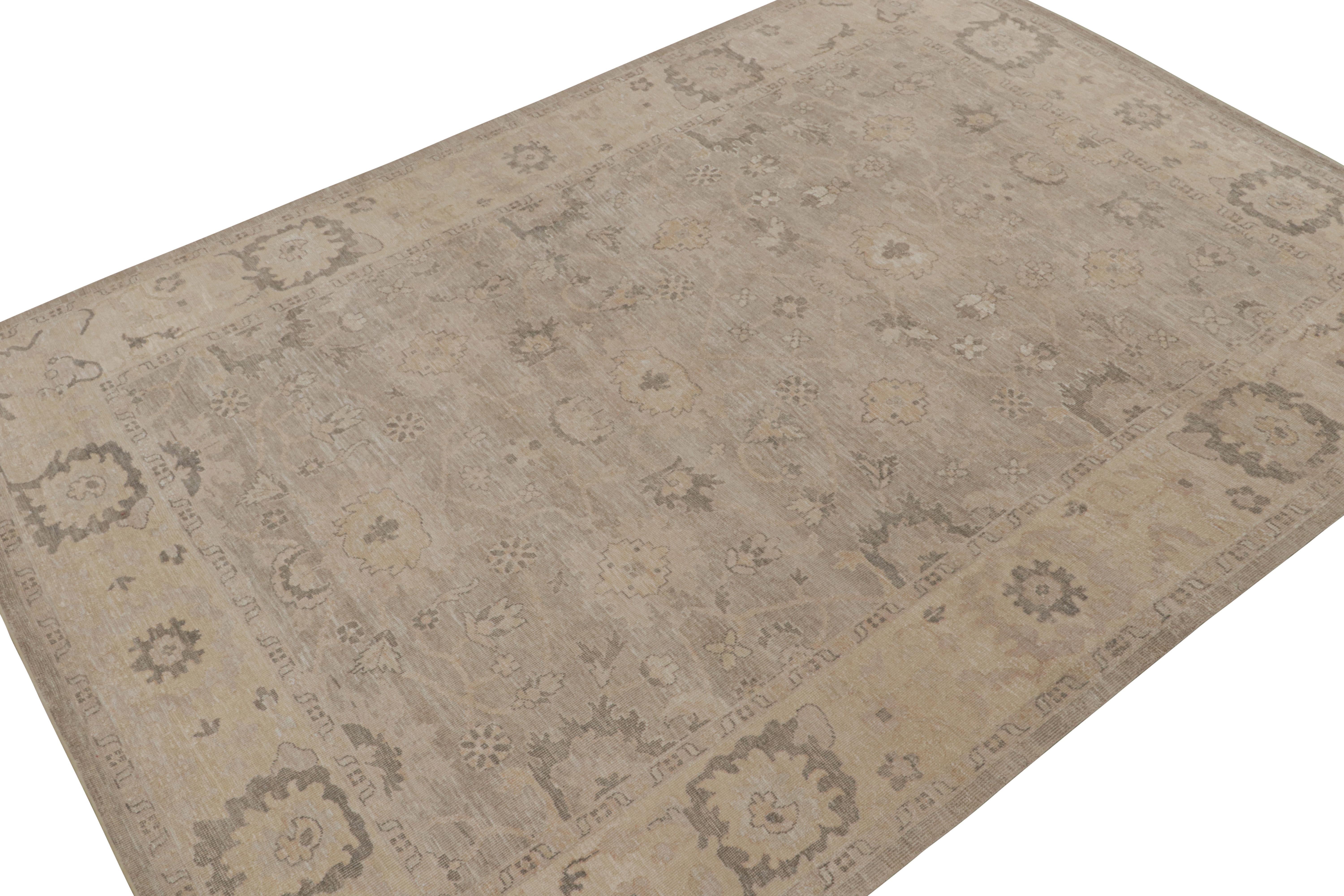 Handknotted in silk, a 10x14 piece from our new line of rugs in this collection inspired by antique Oushak rugs.

On the Design:

This piece enjoys an all over floral pattern in tones gray & beige. The design is complementary to the rustic,