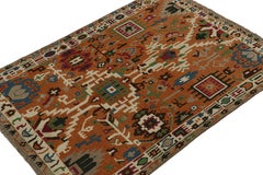 Rug & Kilim’s Oushak style rug in Orange with Colorful Geometric Patterns