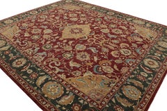 Rug & Kilim’s Oversized Agra Style Rug in Red, Gold, and Green Floral Patterns