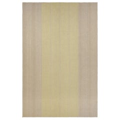 Kilim contemporáneo sobredimensionado de Rug
Kilim con rayas beige y doradas texturadas