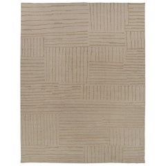Rug 
Kilim è un tappeto contemporaneo oversize dai toni beige-marroni.