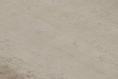 Rug & Kilim’s Oversized Contemporary Textural Solid Rug in Beige Tones