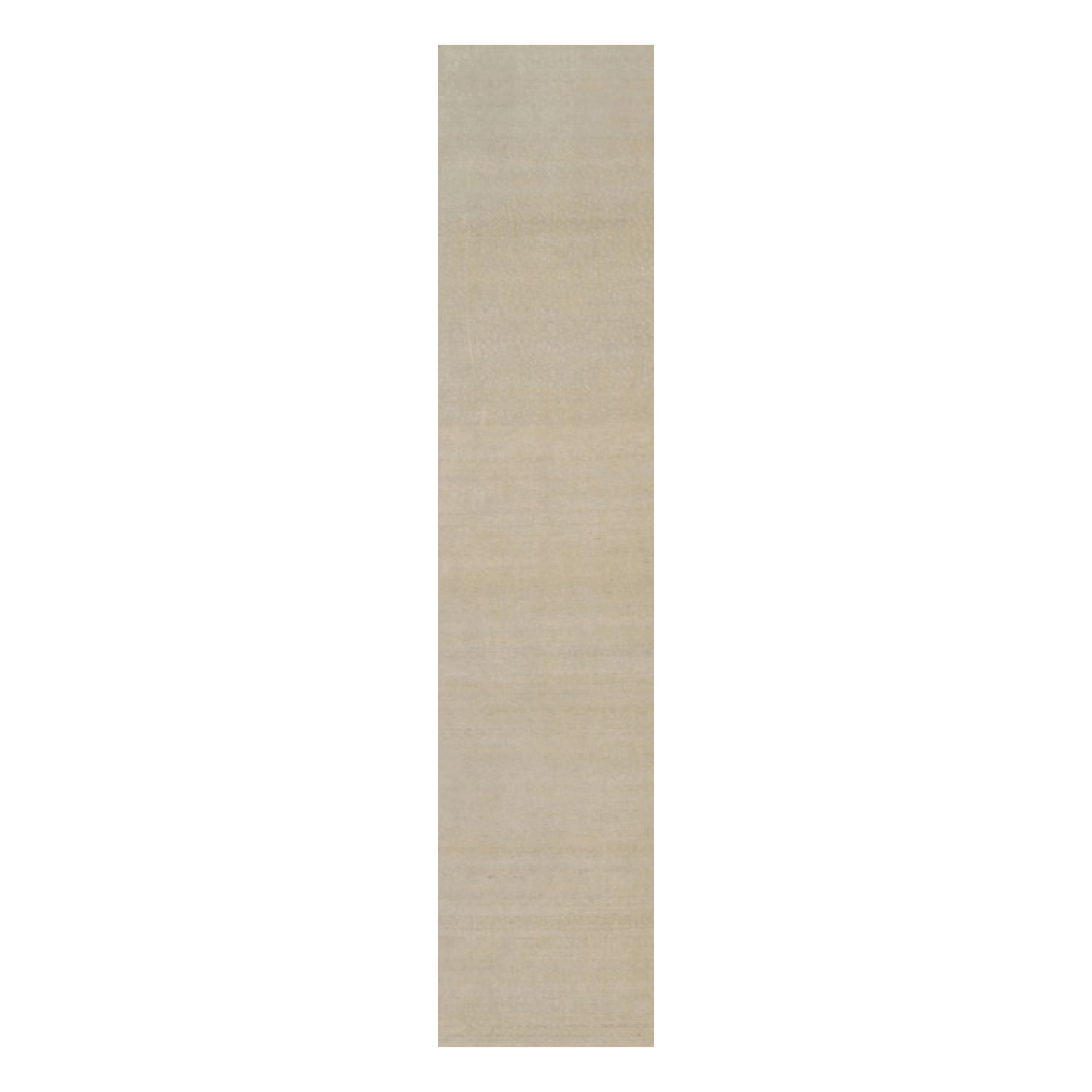 Rug & Kilim’s Oversized Contemporary Textural Solid Rug in Beige Tones
