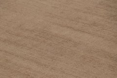 Rug & Kilim’s Oversized Contemporary Textural Solid Rug in Brown Tones