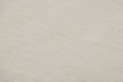 Rug & Kilim’s Oversized Contemporary Textural Solid Rug in Ivory Tones