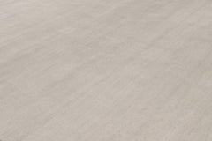 Rug & Kilim’s Oversized Contemporary Textural Solid Rug in Ivory Tones