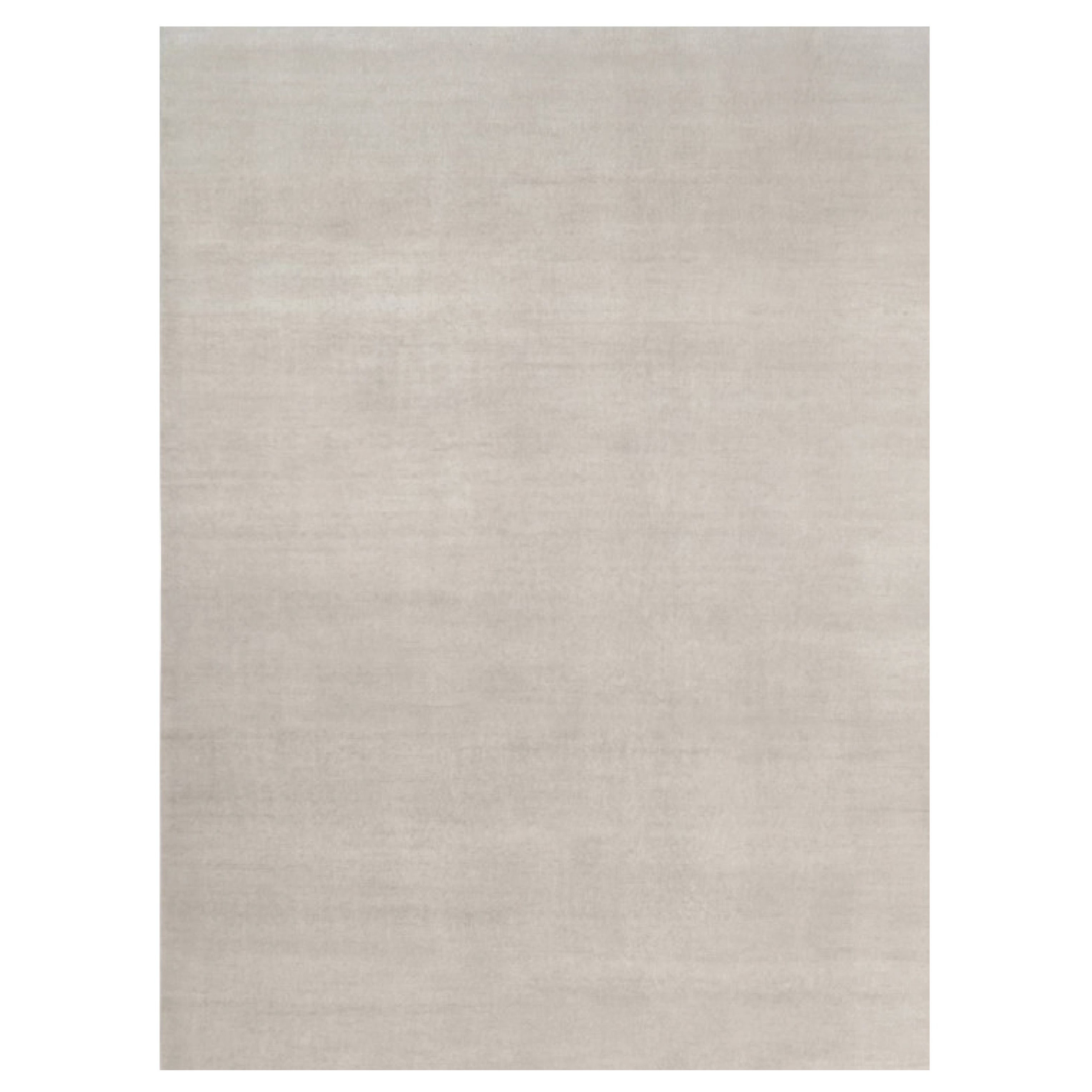 Rug & Kilim’s Oversized Contemporary Textural Solid Rug in Ivory Tones