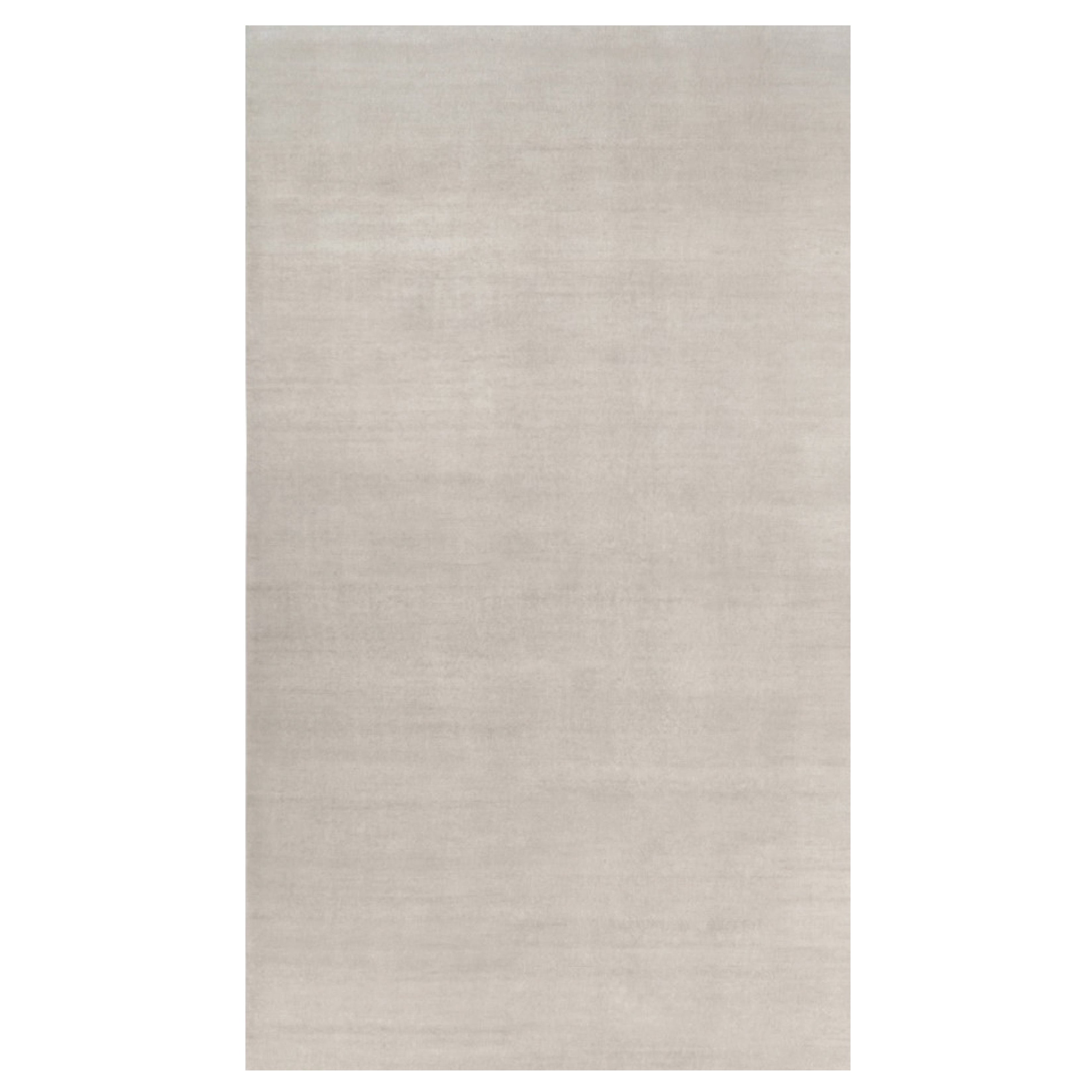 Rug & Kilim’s Oversized Contemporary Textural Solid Rug in Ivory Tones