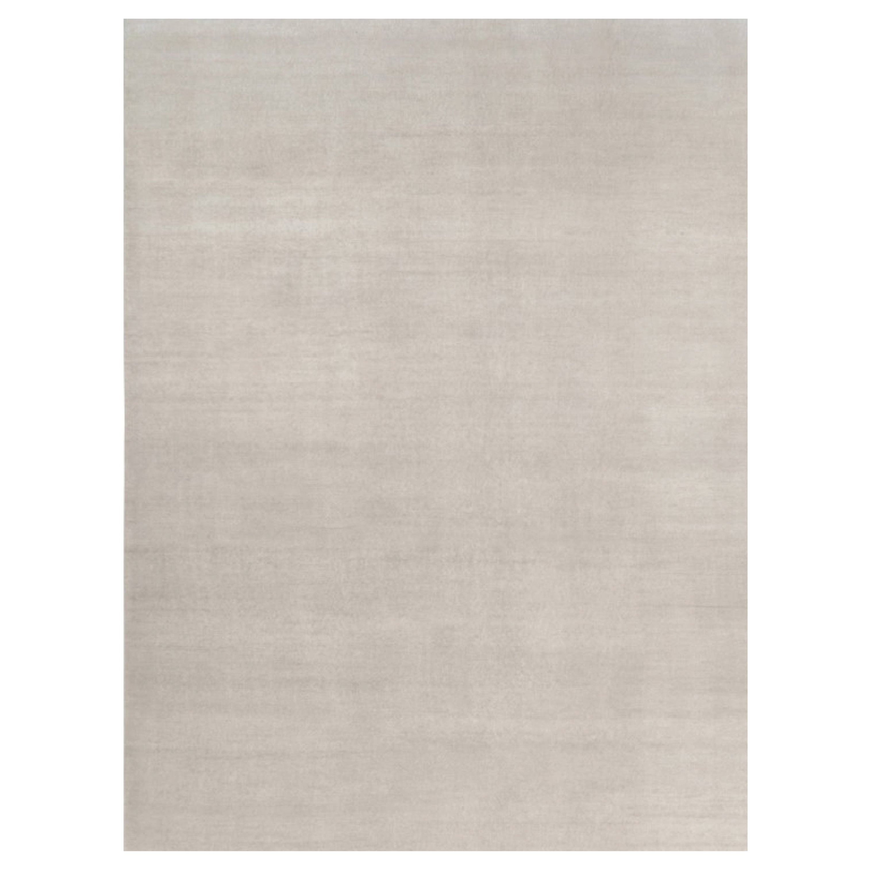 Rug & Kilim’s Oversized Contemporary Textural Solid Rug in Ivory Tones