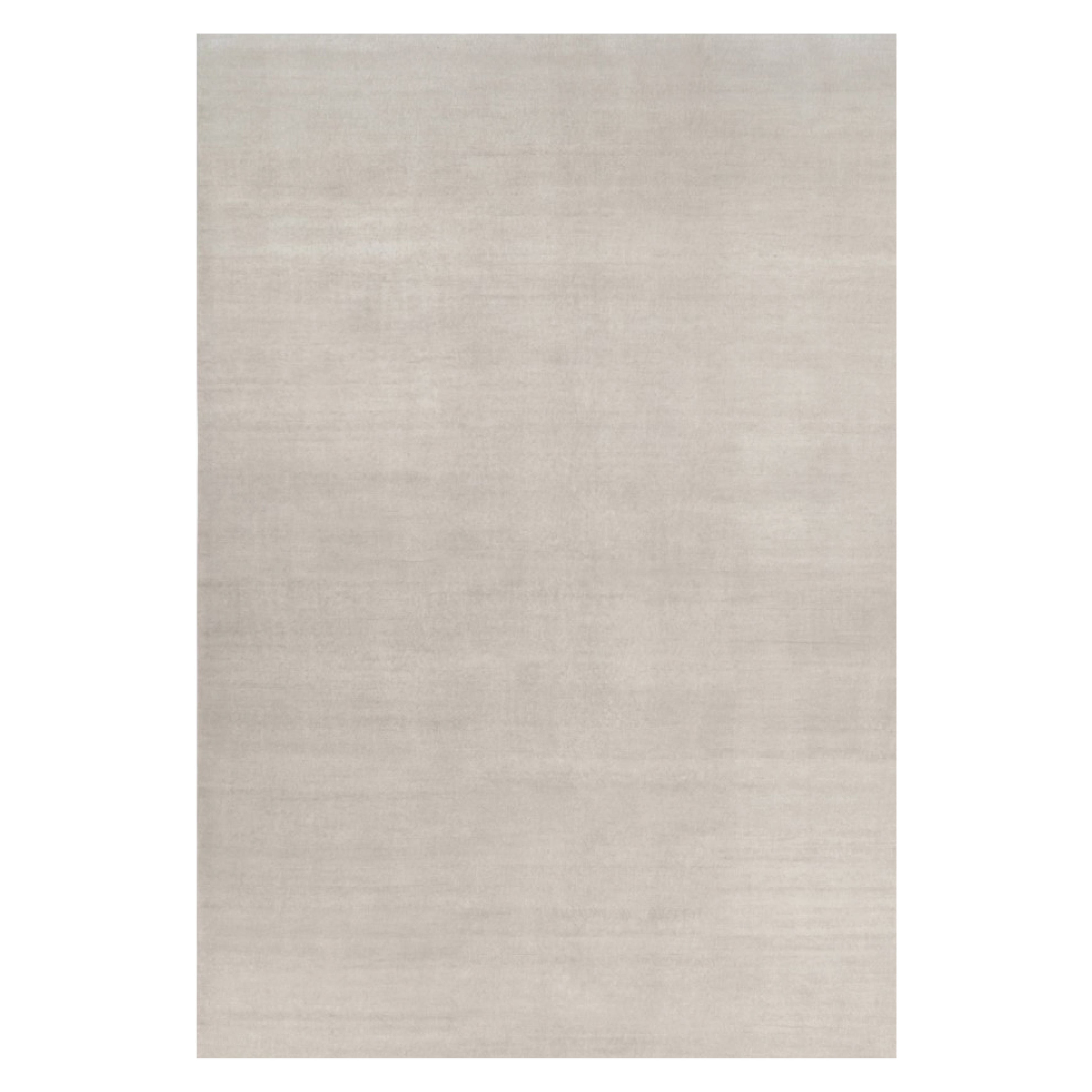 Rug & Kilim’s Oversized Contemporary Textural Solid Rug in Ivory Tones