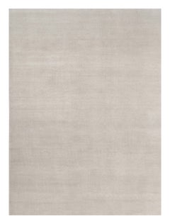 Alfombra sólida de textura contemporánea sobredimensionada en tonos marfil de Rug & Kilim
