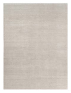 Alfombra sólida de textura contemporánea sobredimensionada en tonos marfil de Rug & Kilim