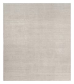 Alfombra sólida de textura contemporánea sobredimensionada en tonos marfil de Rug & Kilim