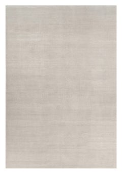 Alfombra sólida de textura contemporánea sobredimensionada en tonos marfil de Rug & Kilim