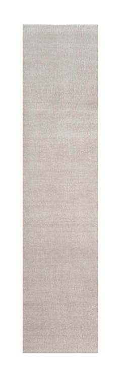 Rug & Kilim’s Oversized Contemporary Textural Solid Rug in Ivory Tones