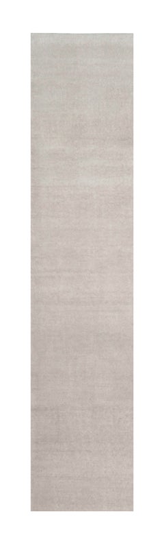 Rug & Kilim’s Oversized Contemporary Textural Solid Rug in Ivory Tones